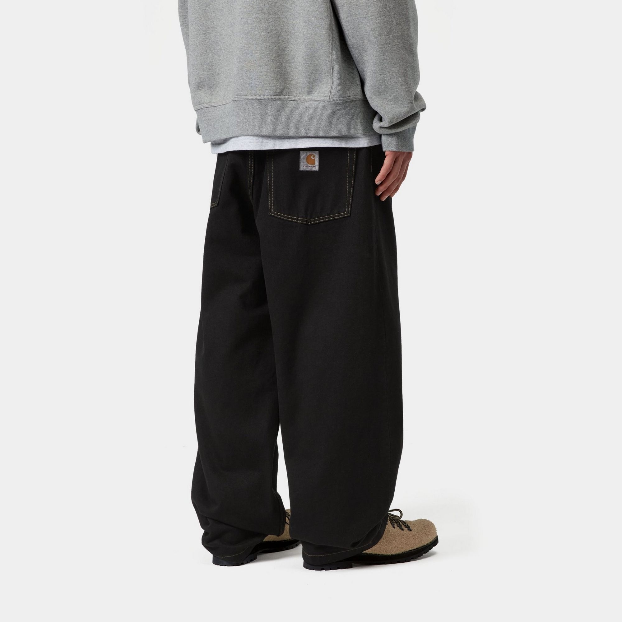 Model wearing a pair of Brandon Pants in Black