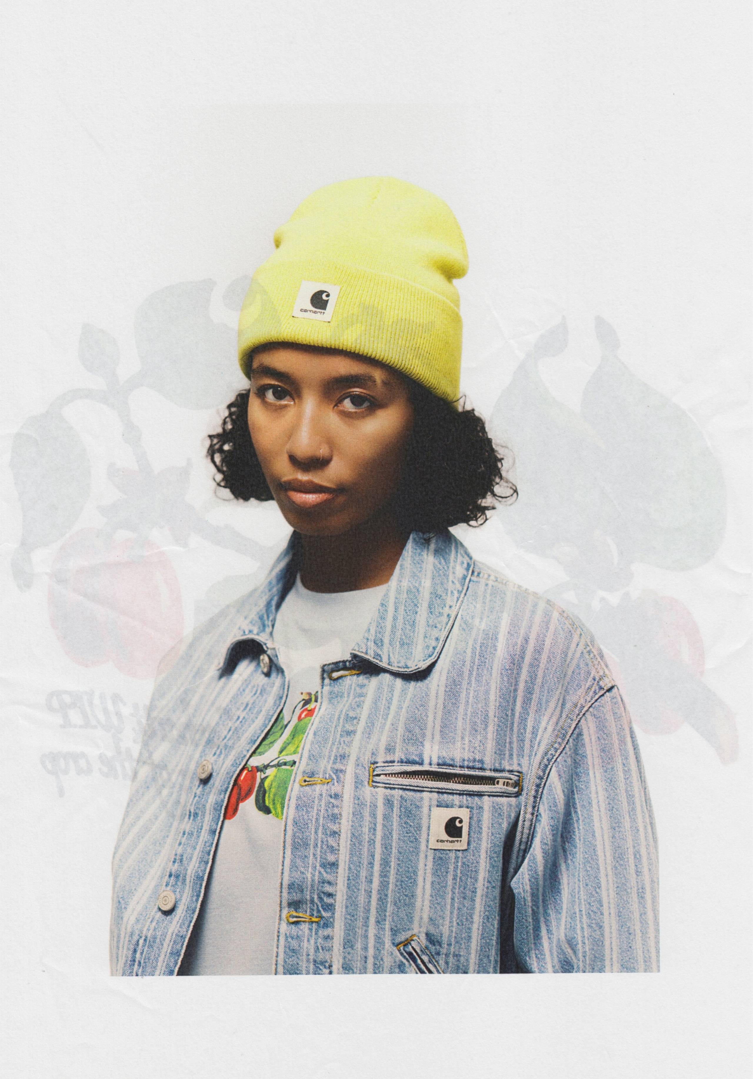 Model wearing Carhartt WIP Rylan Jacket and yellow Beanie