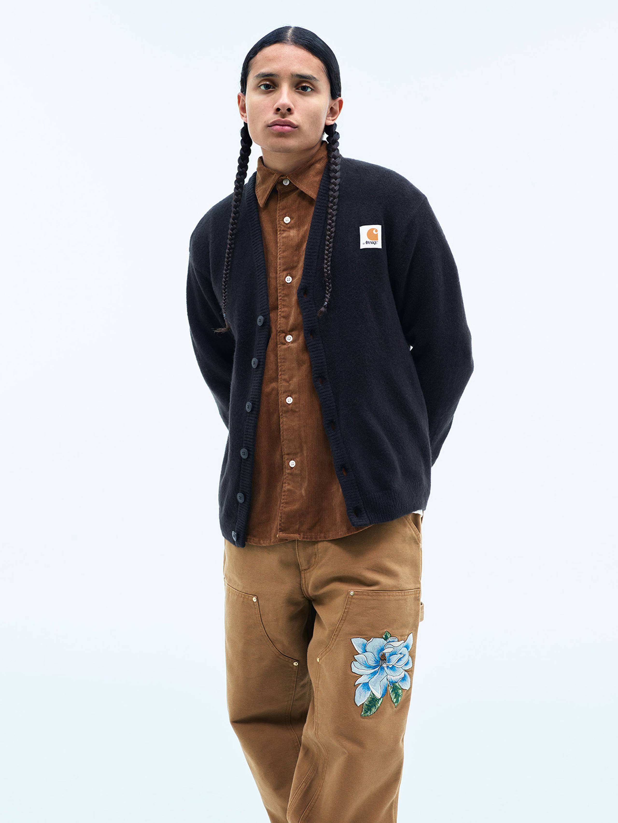 Model wearing Carhartt WIP x Awake NY cardigan in navy blue