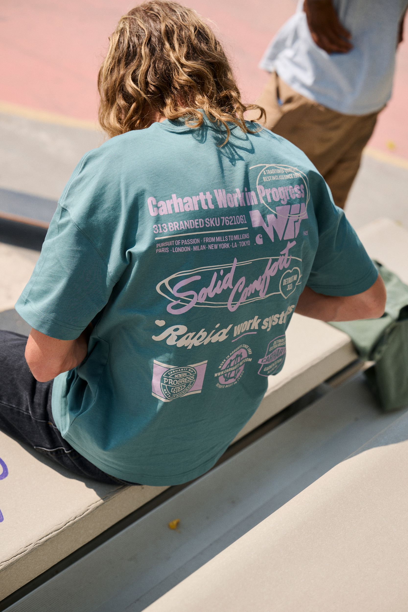 Skater wearing a Networks T-Shirt in Silver Pine