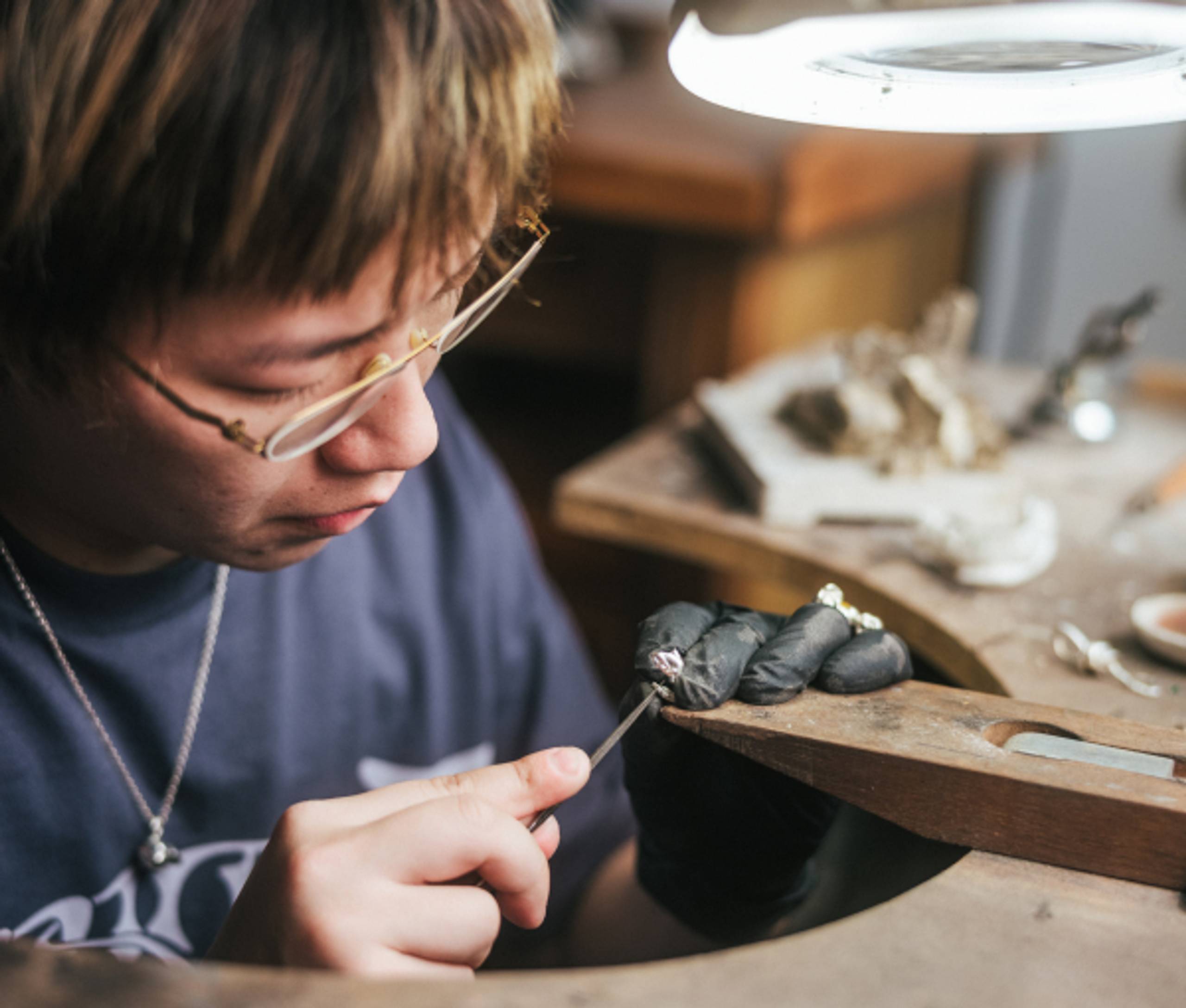 Jewelry Designer Eric Wu working in studio