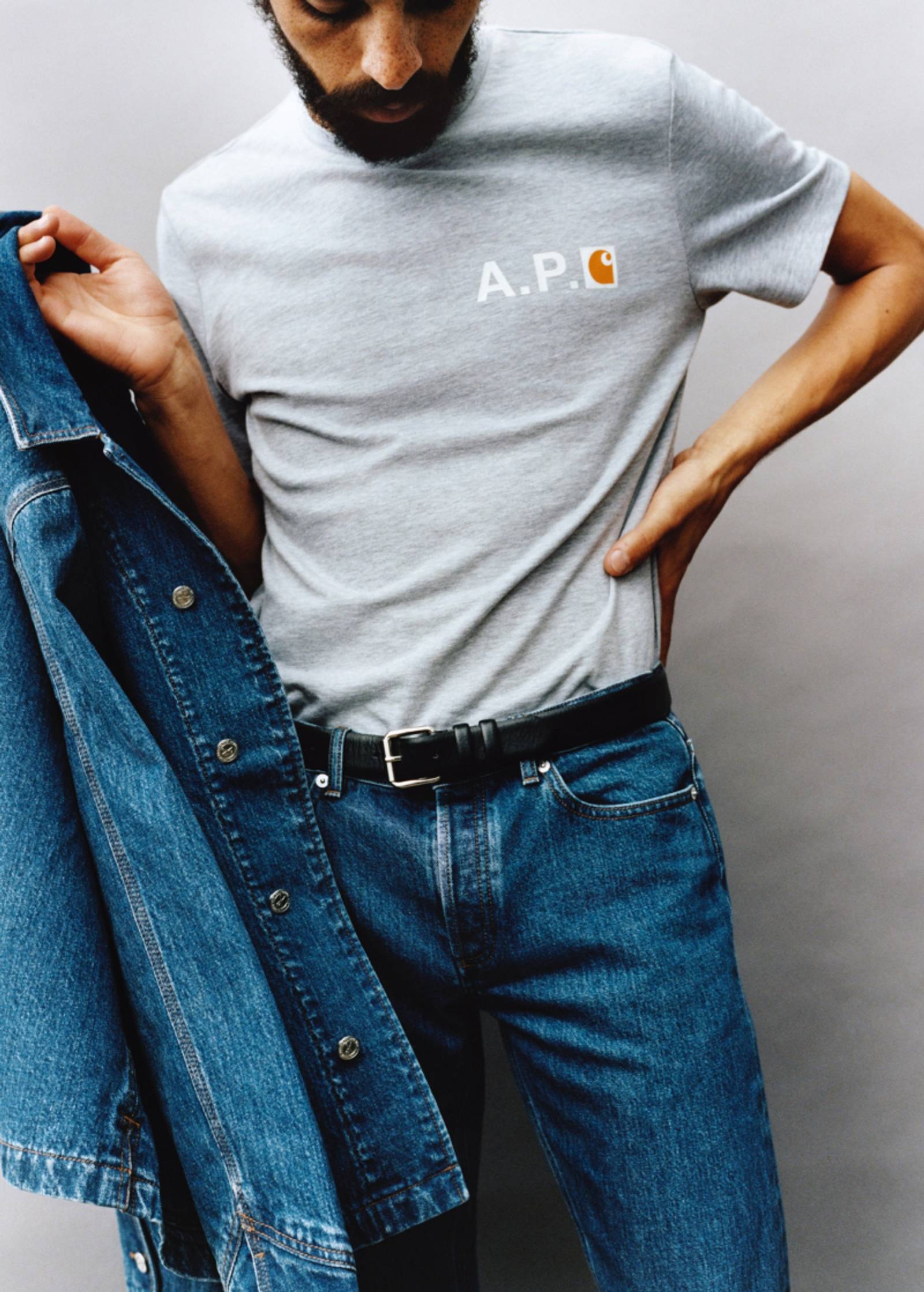 Model wearing items from A.P.C. x Carhartt WIP collection