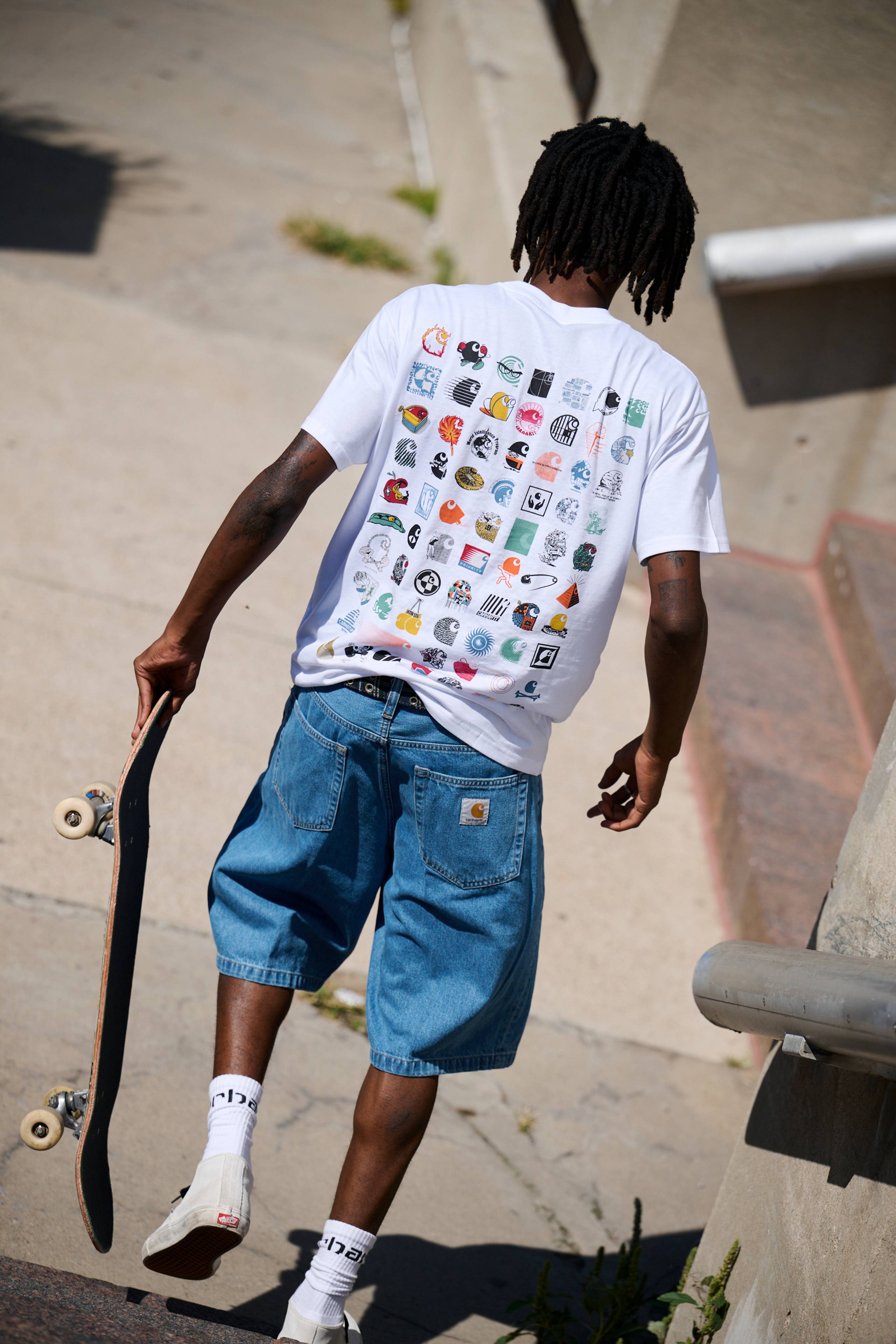 Skater wearing a C Logo T-Shirt in White