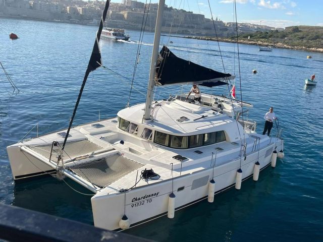 Chardonnay catamaran under way off Malta.