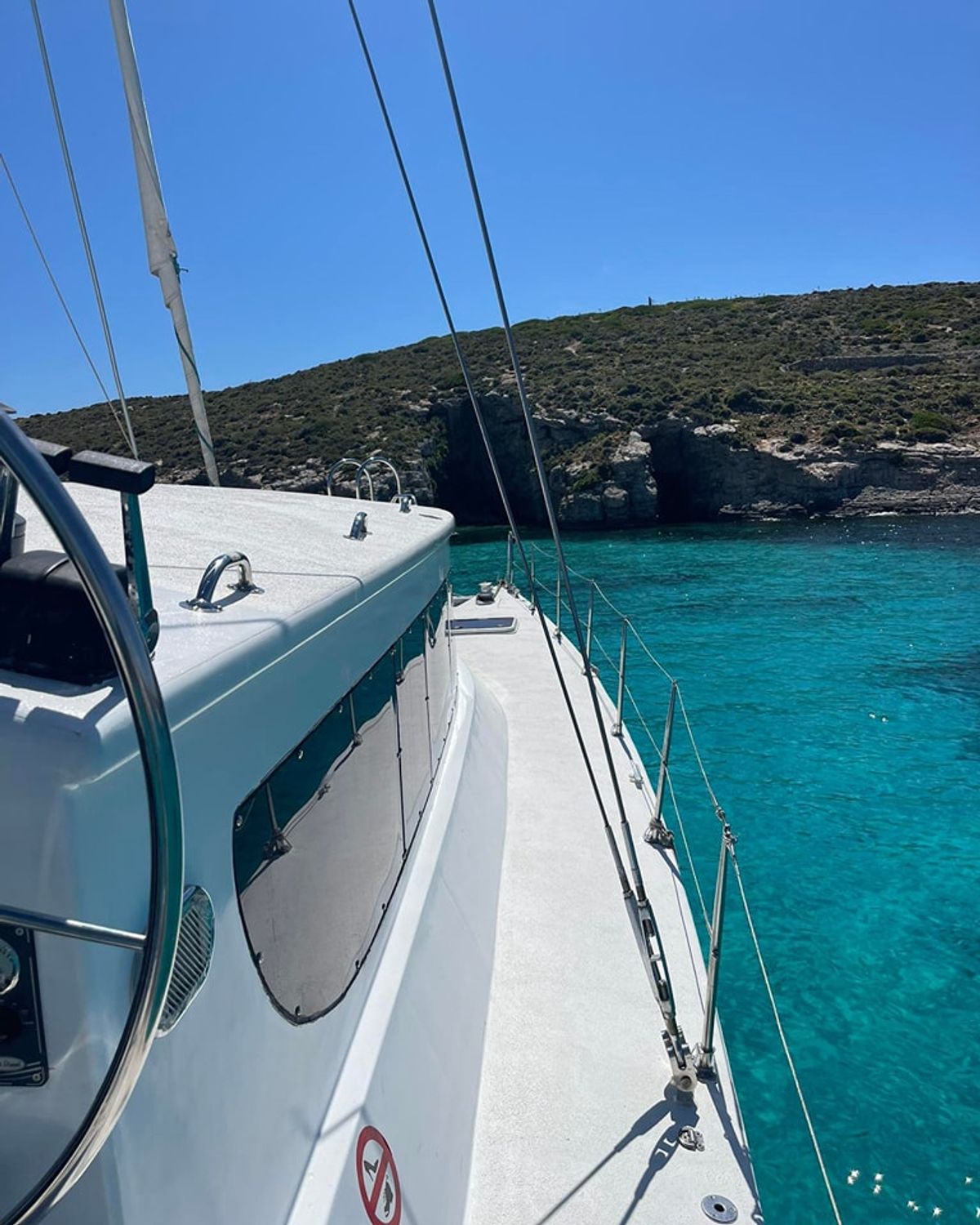 Catamaran anchored between Gozo and Comino