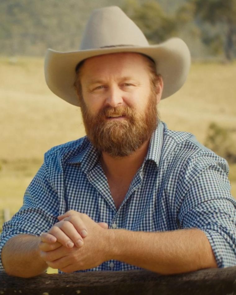 Client portrait — man in an akubra hat on a cattle property