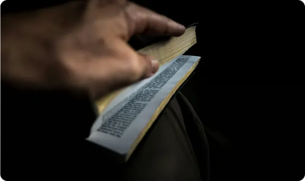 A man opens a bible