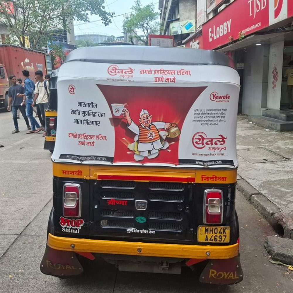 Auto-rickshaw branding vs hoardings: which gives better local ROI in 2026?