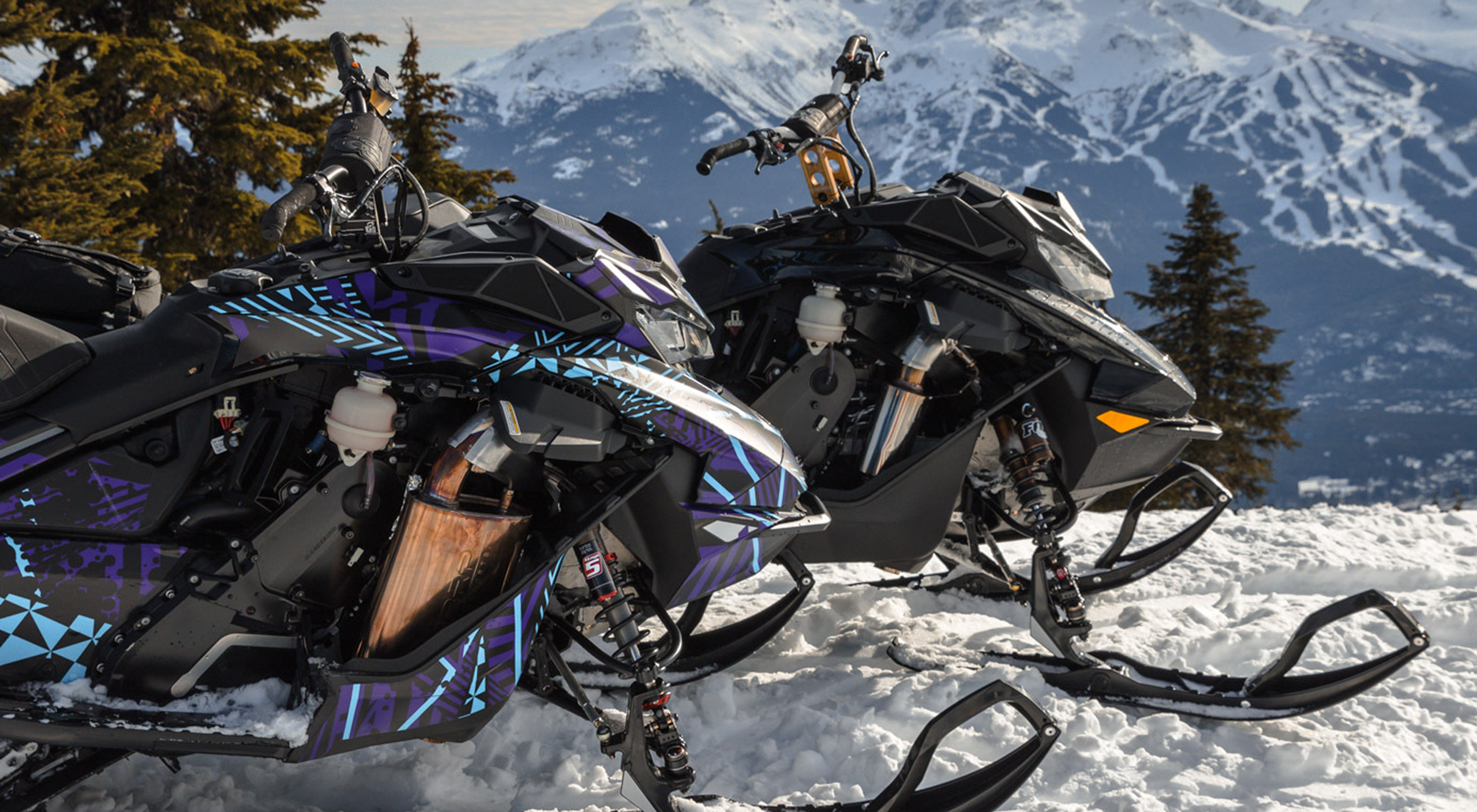 MBRP systems on snowmobiles in the mountains during winter