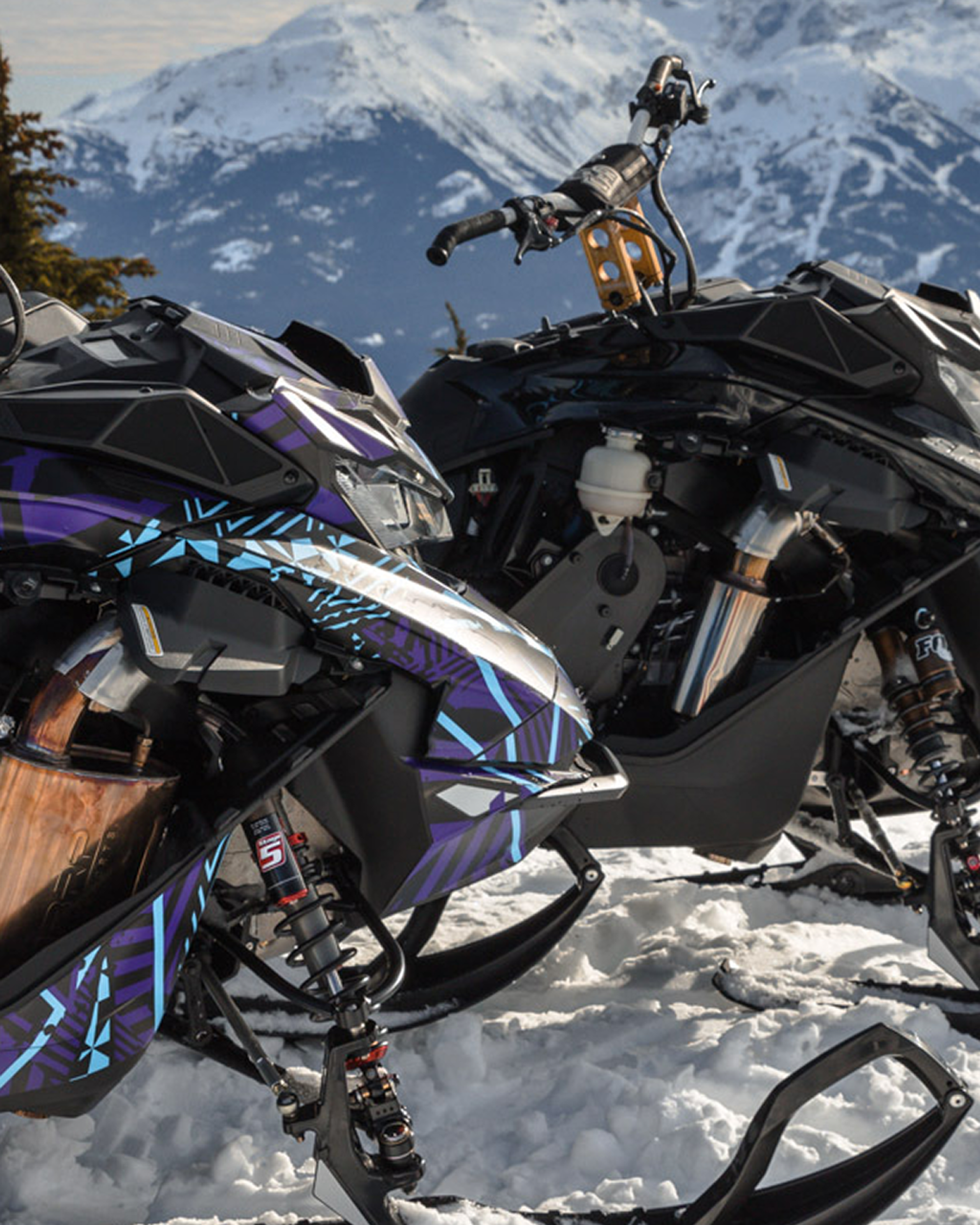 MBRP systems on snowmobiles in the mountains during winter