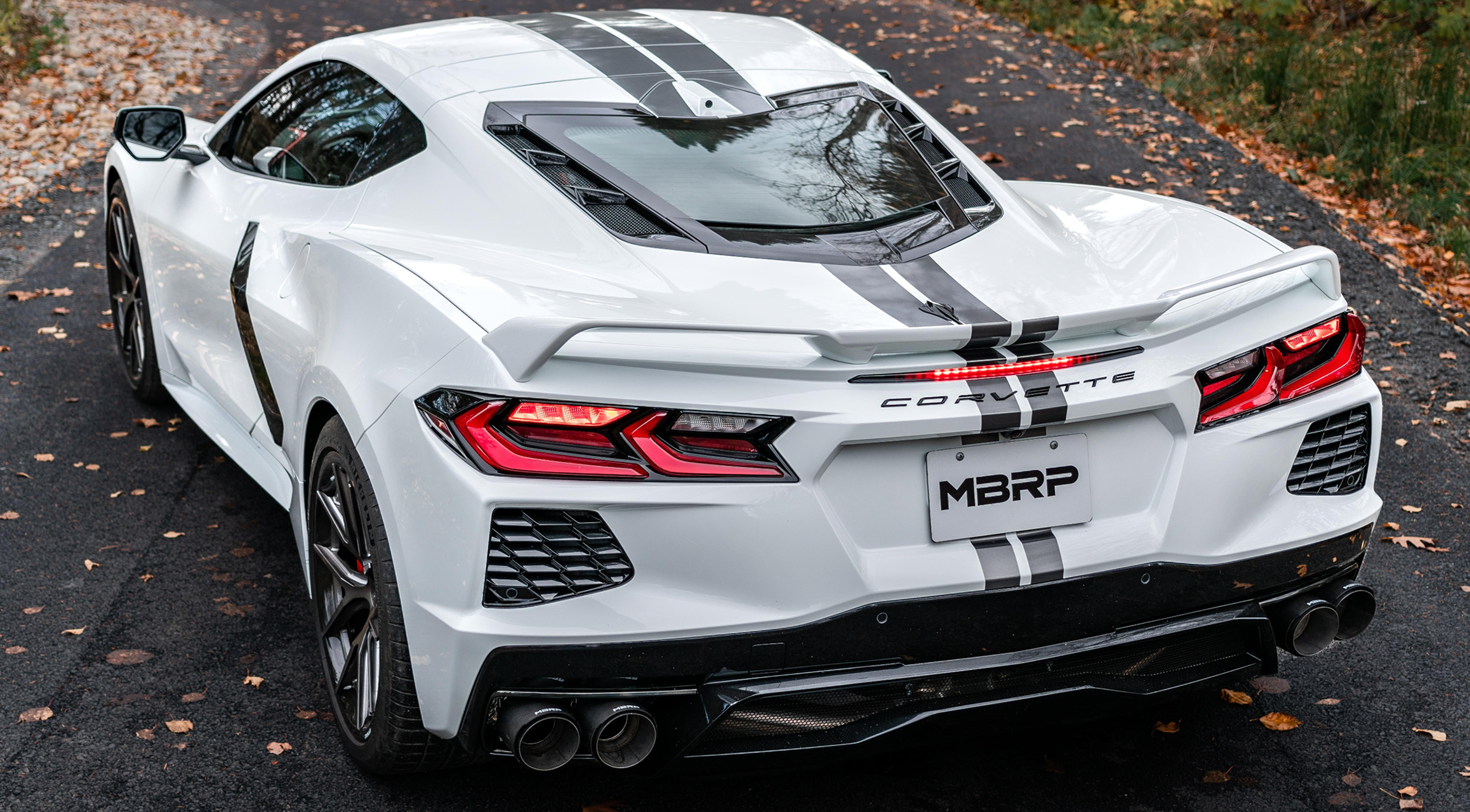 White Corvette with an mbrp dual rear exit exhaust system