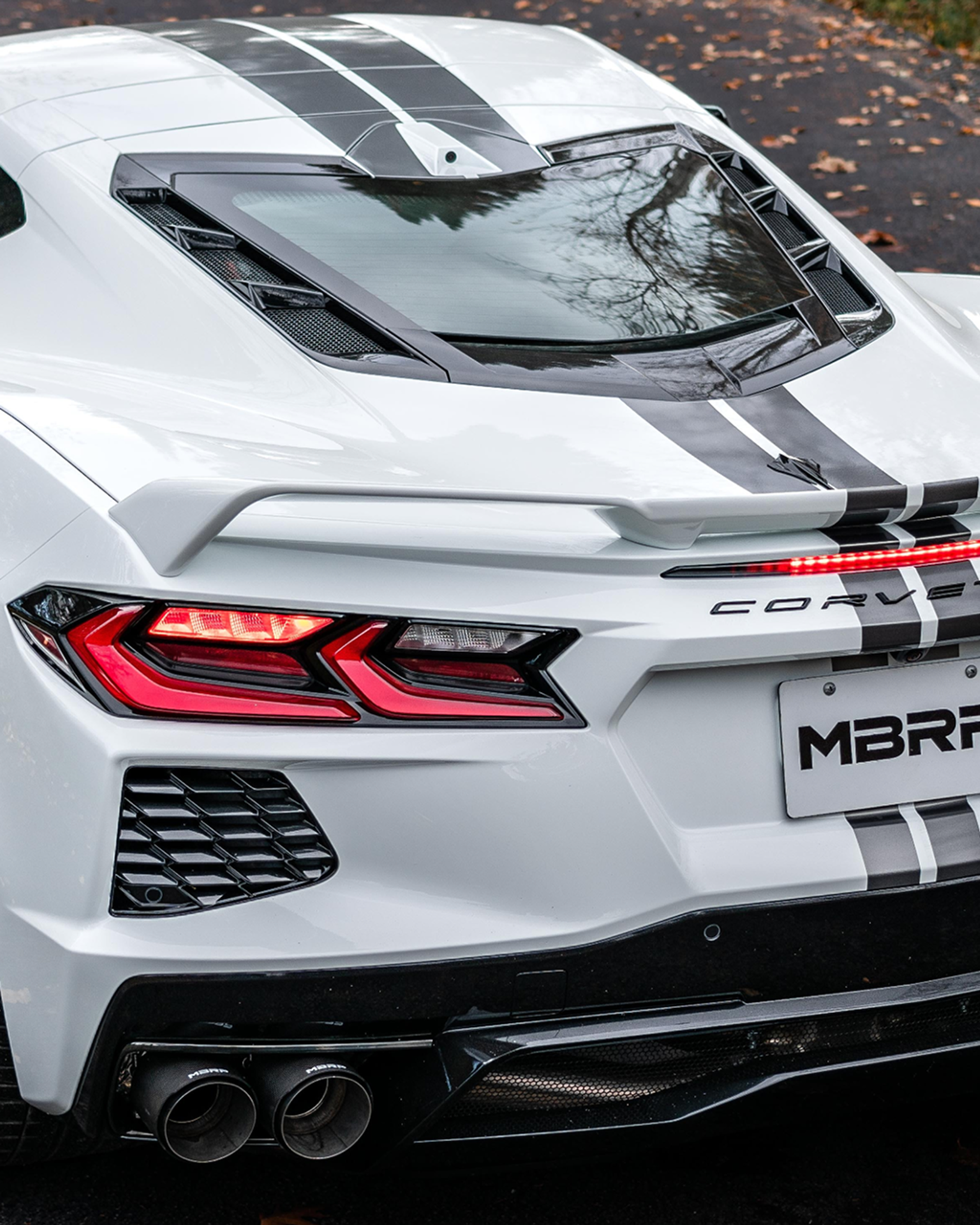 White Corvette with an mbrp dual rear exit exhaust system
