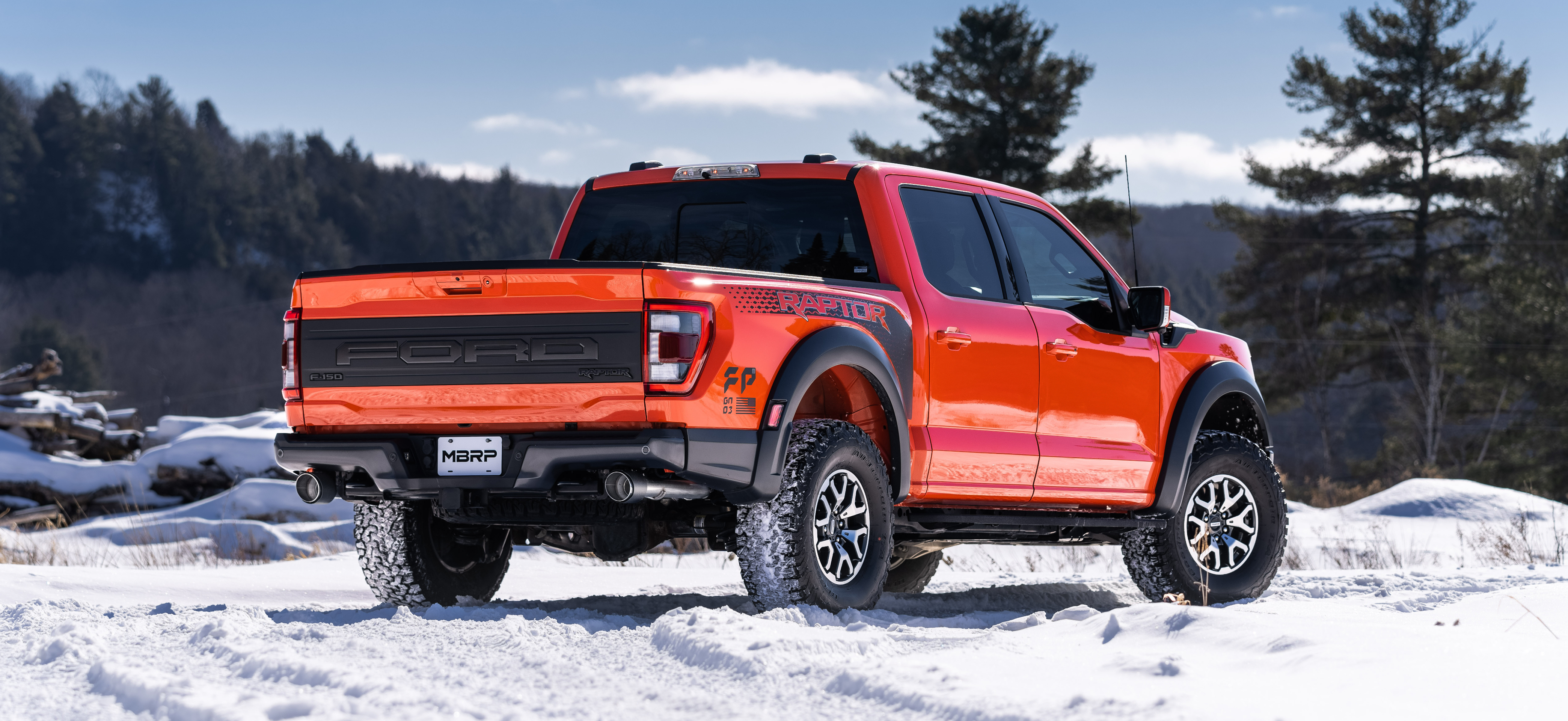 Electric Red Ford Raptor with an mbrp exhaust kit installed