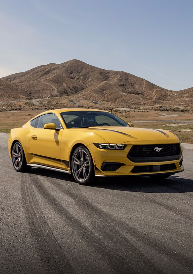 Yellow Ford Mustang on the track