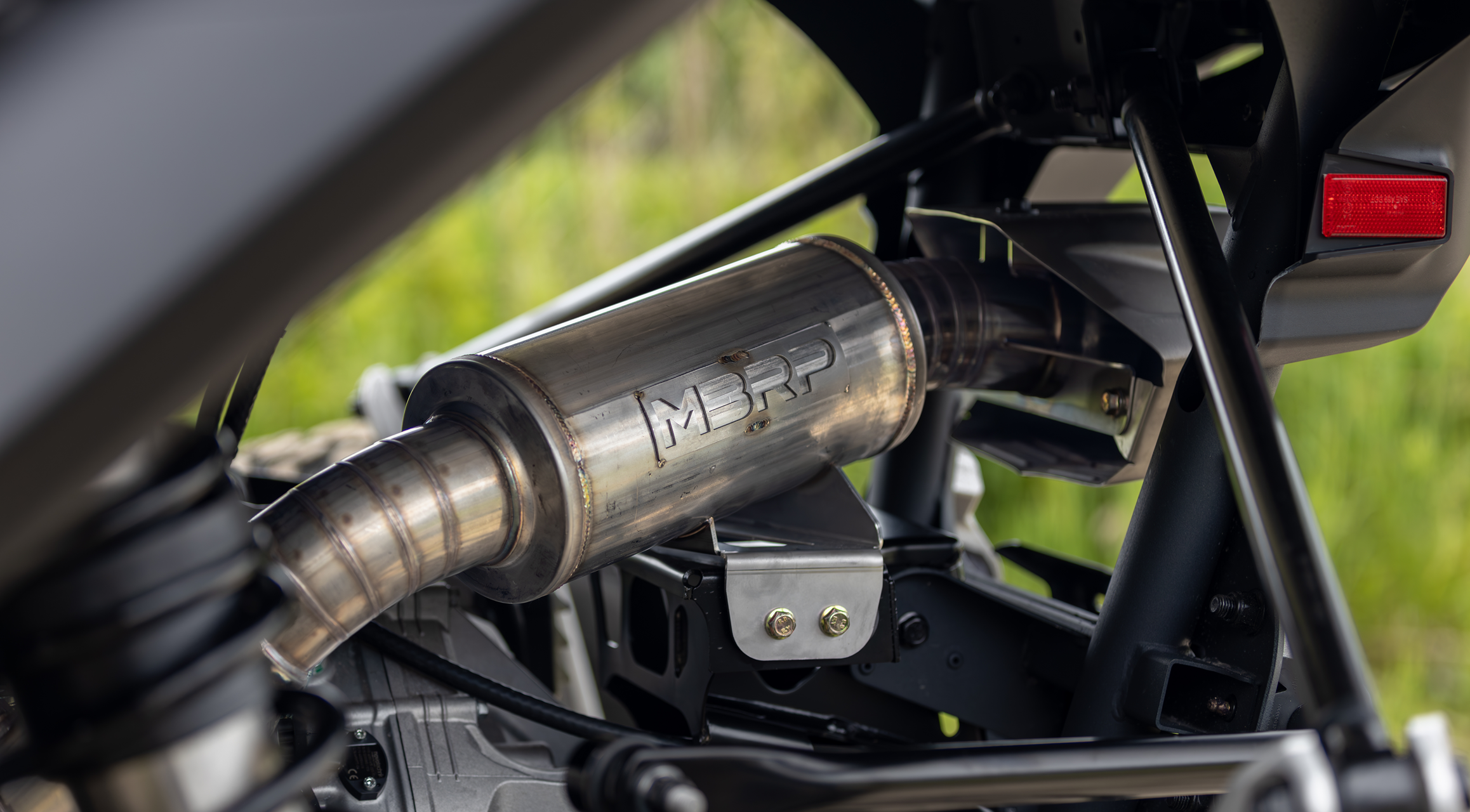 Close up of an mbrp exhaust system on an atv
