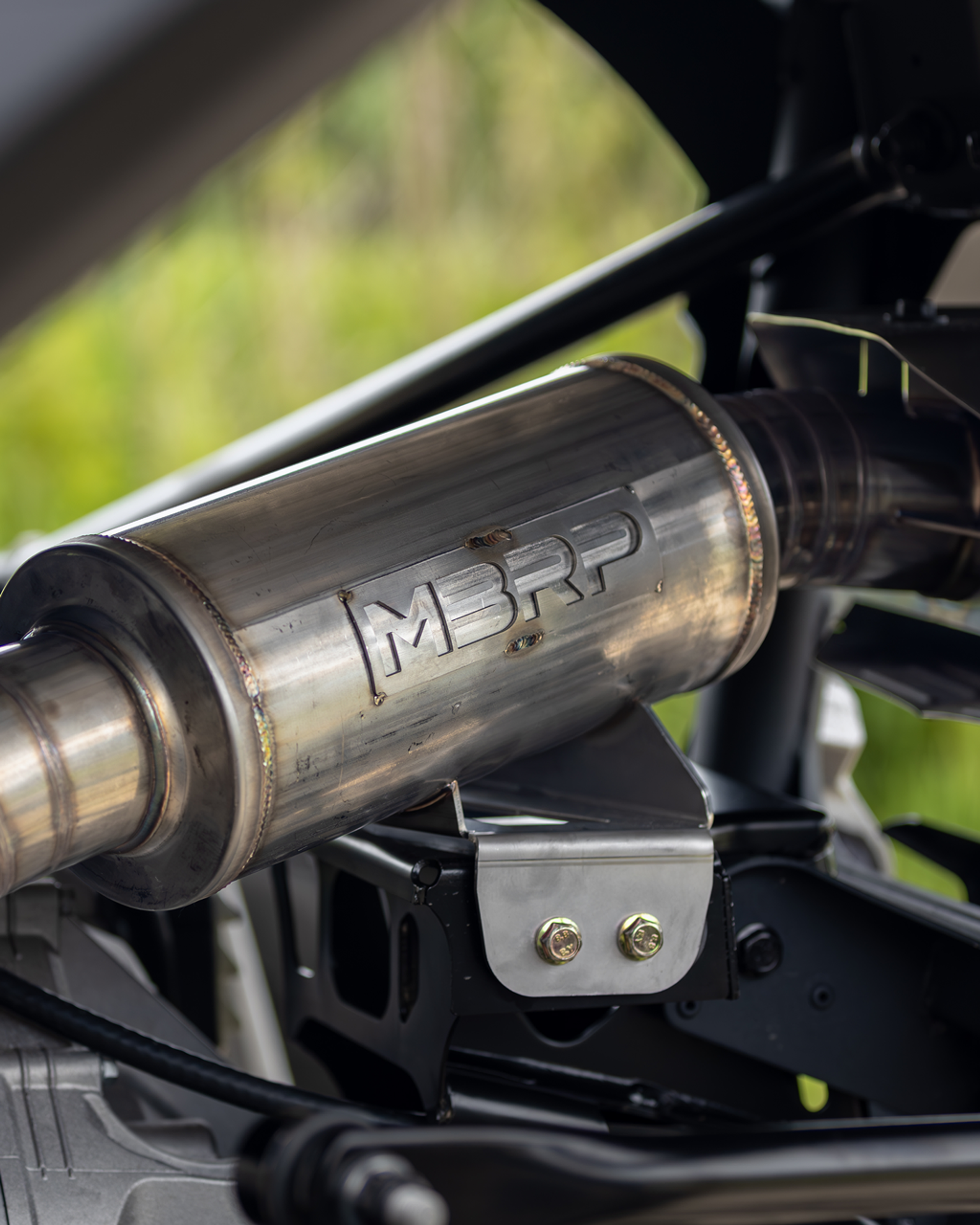 Close up of an mbrp exhaust system on an atv