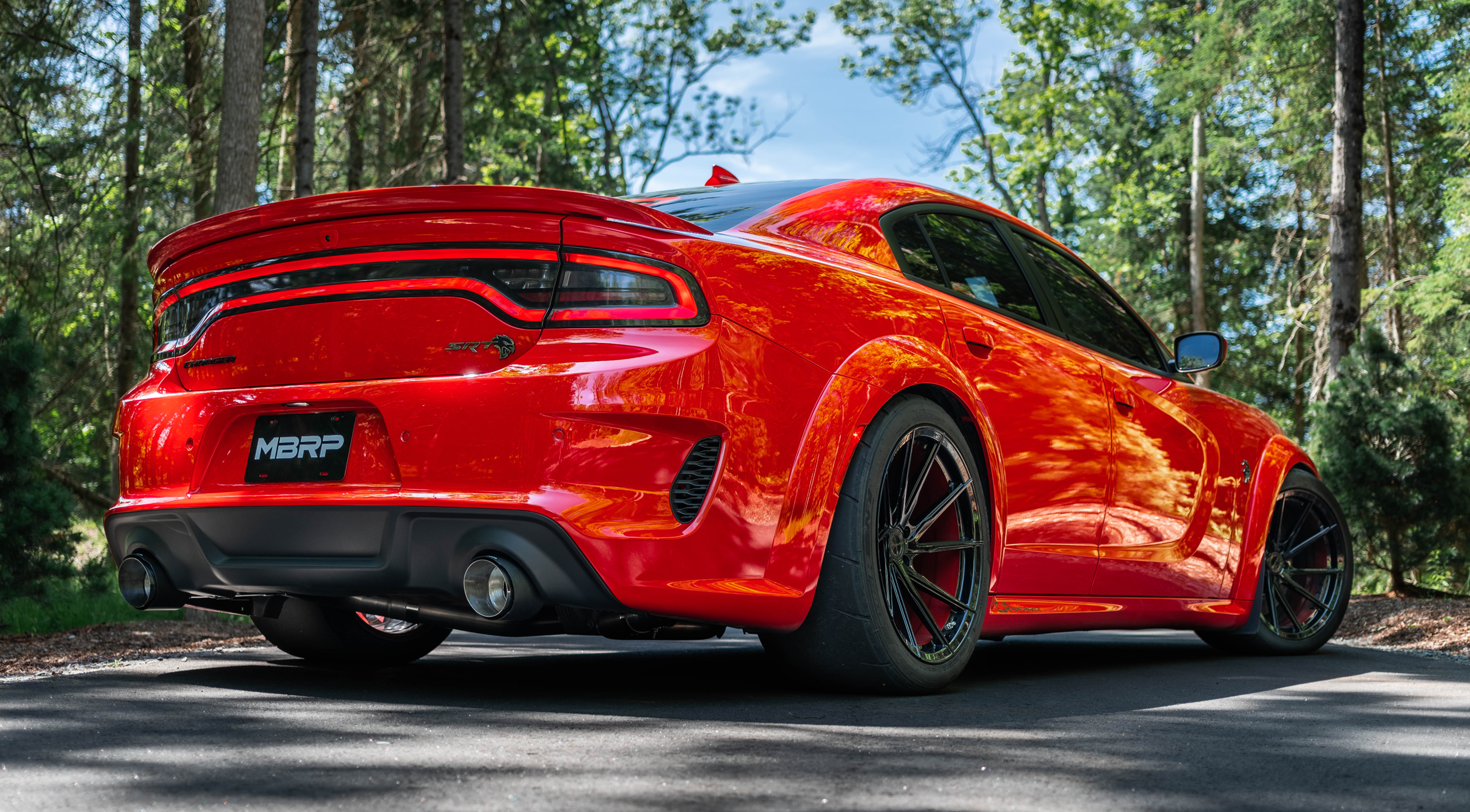 Dodge charger on the street parked showing mbrp carbon fiber tips and exhaust