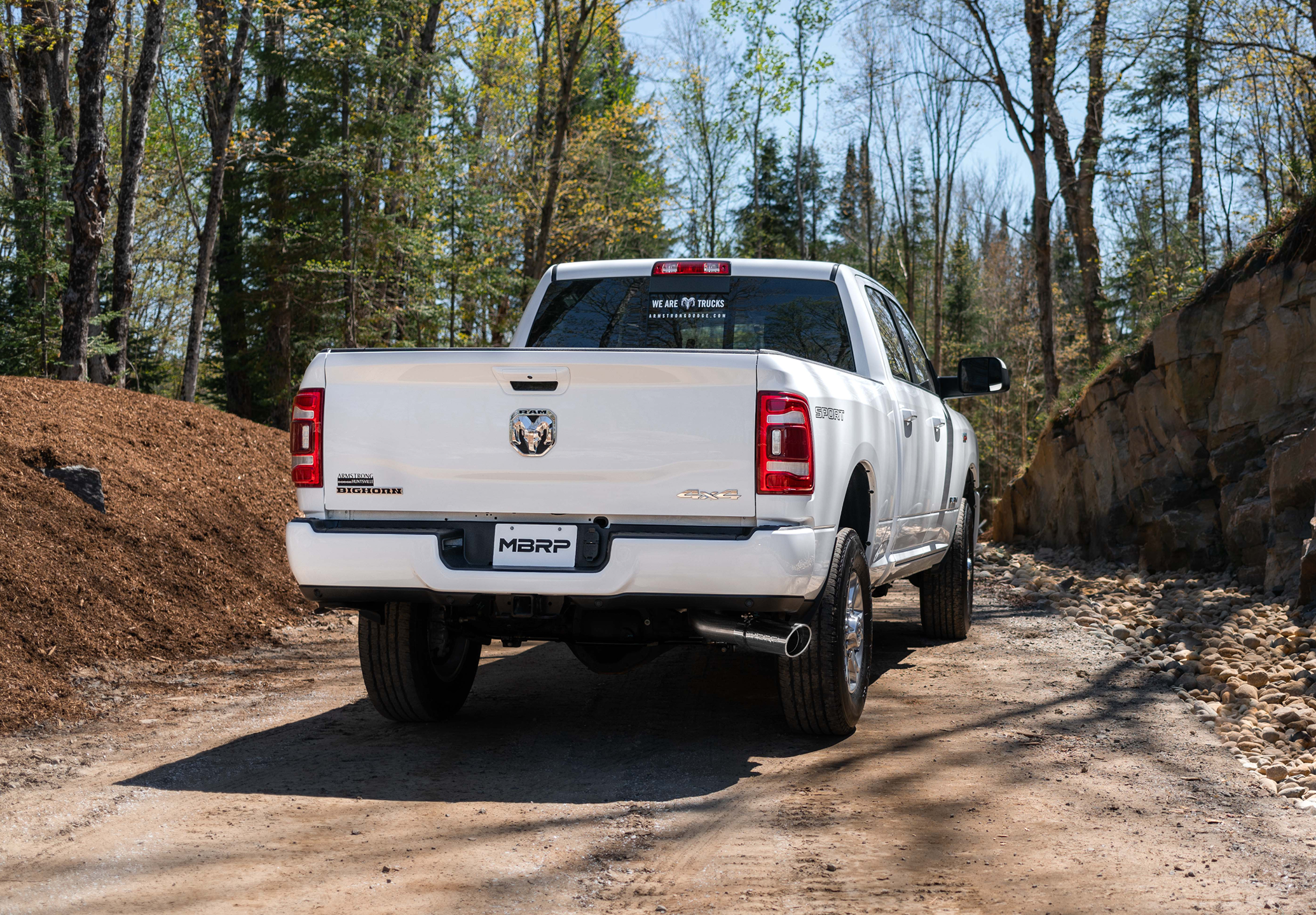 White Ram Longhorn 4x4 on the dirt roads showing an mbrp exhaust system