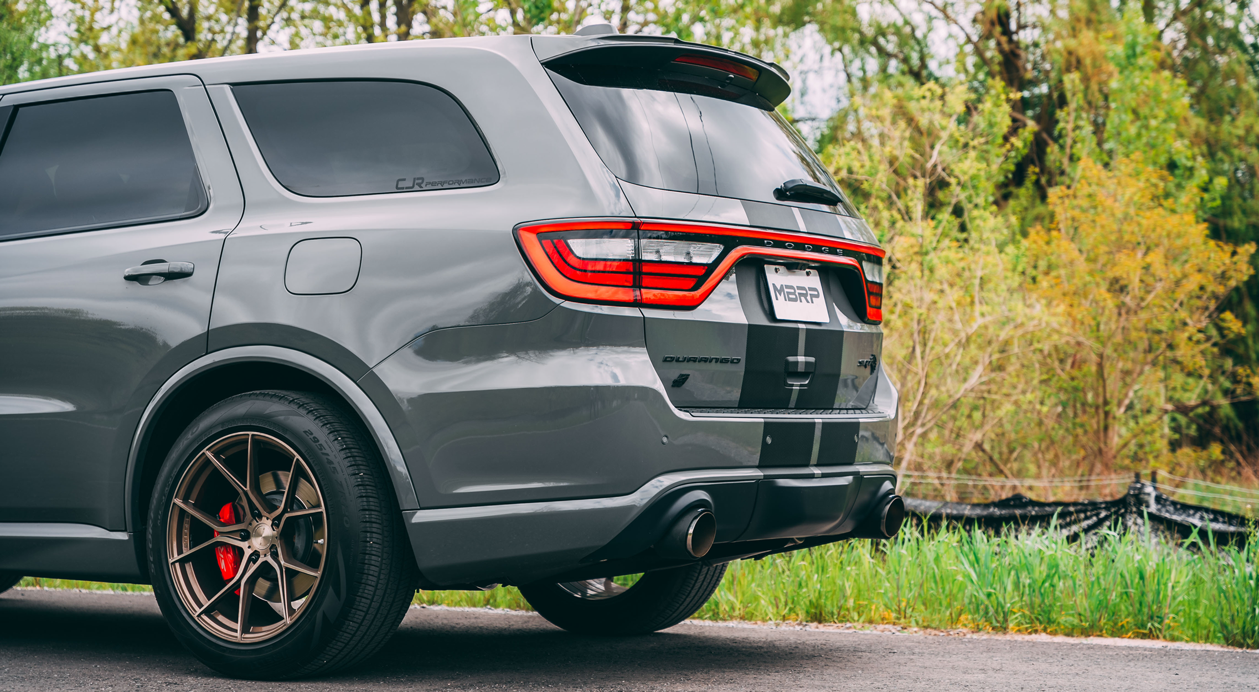 Grey Dodge Durango with mbrp exhaust installed