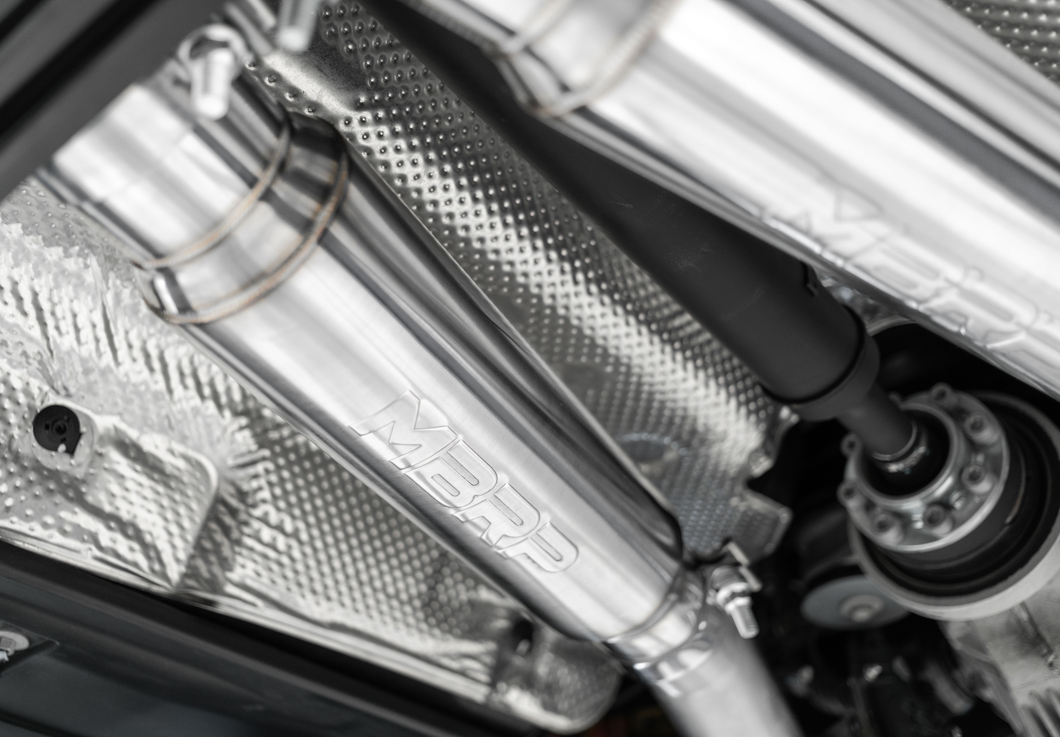 MBRP exhaust installed and shown under the vehicle with high end stainless steel