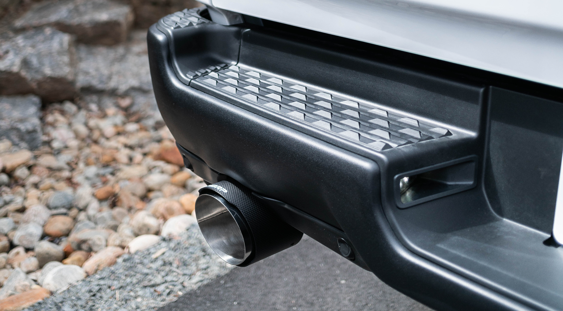 White truck with mbrp carbon fiber tips