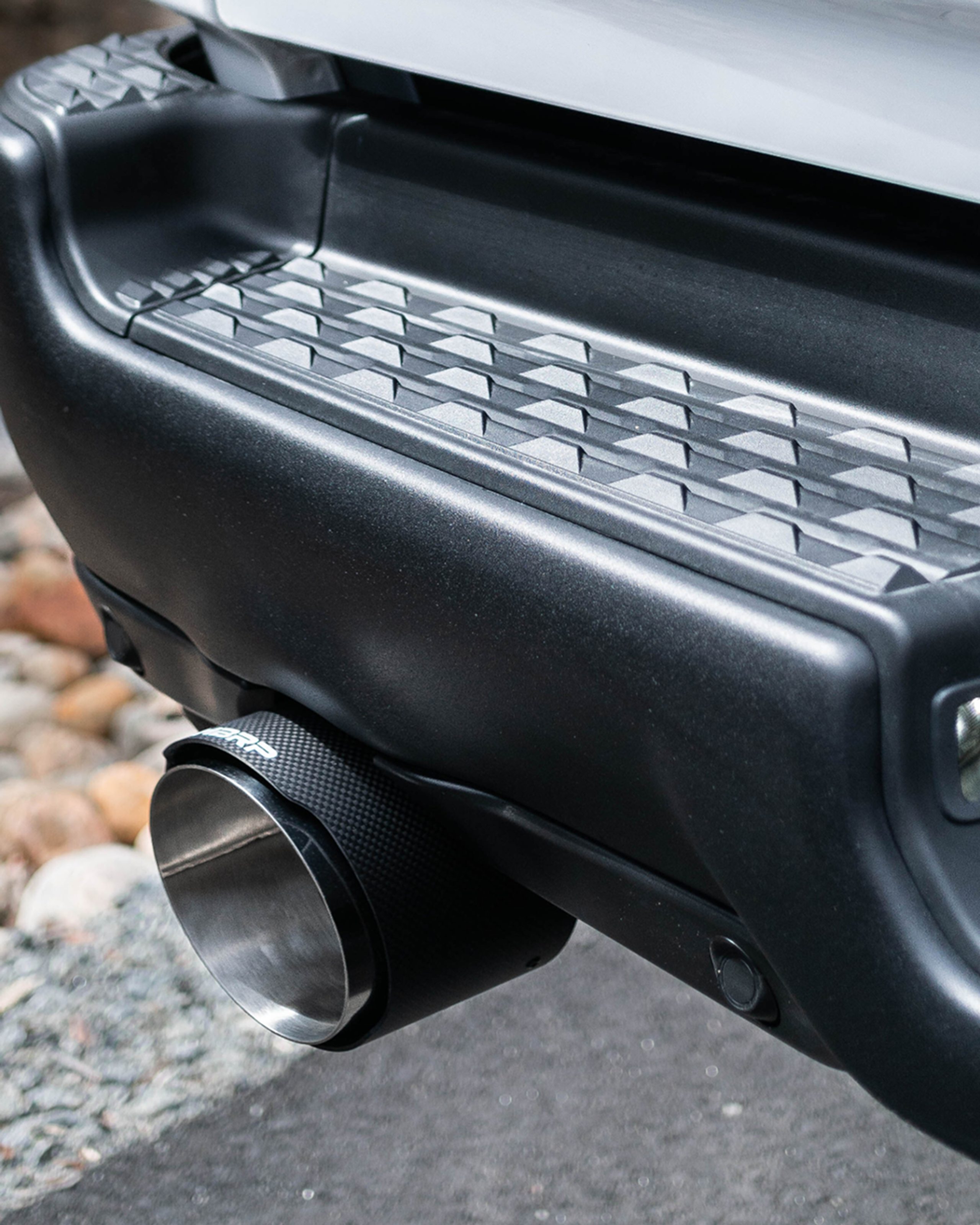 White truck with mbrp carbon fiber tips