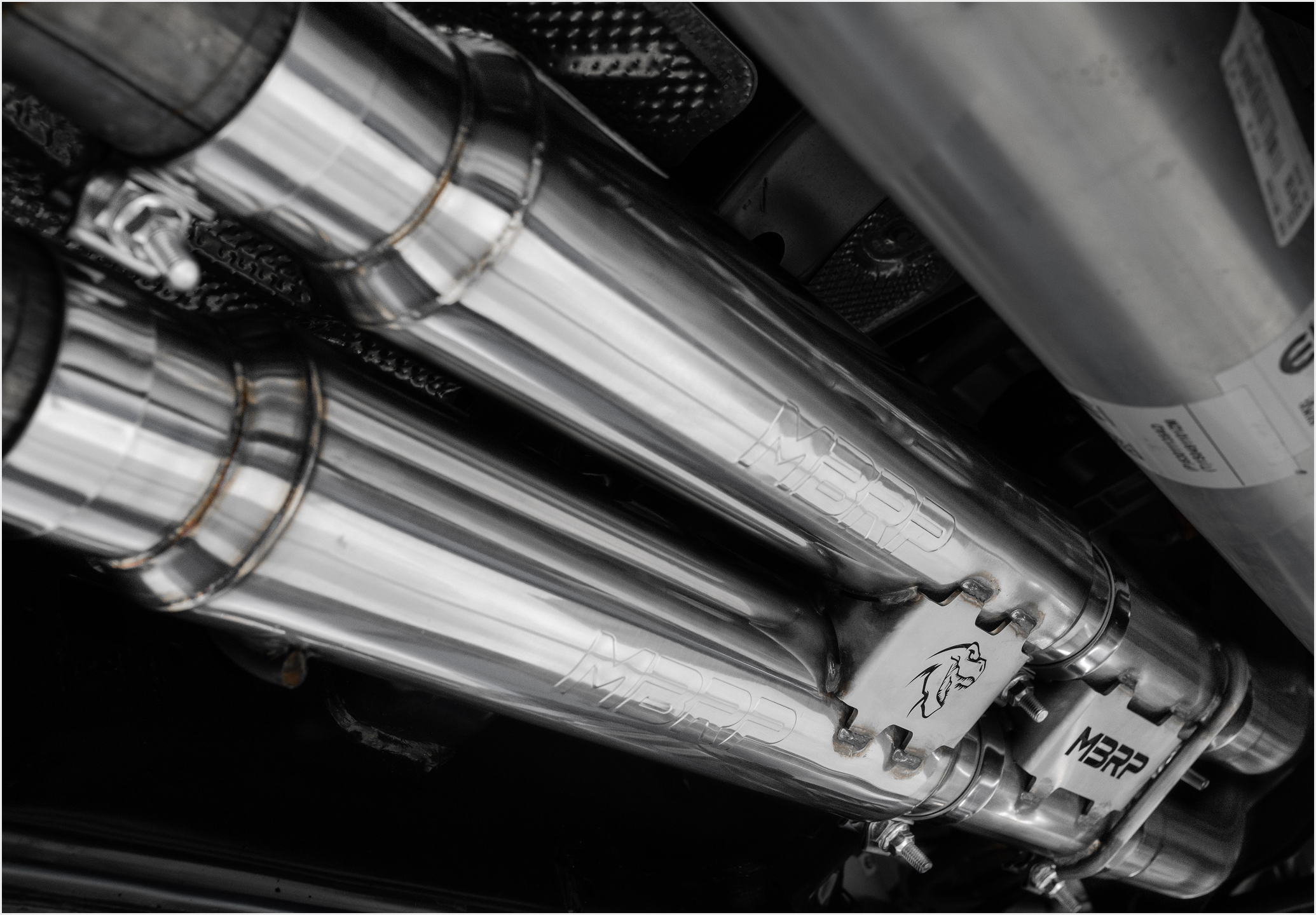 MBRP exhaust install on a Ford Raptor showing the under carriage with expert welding