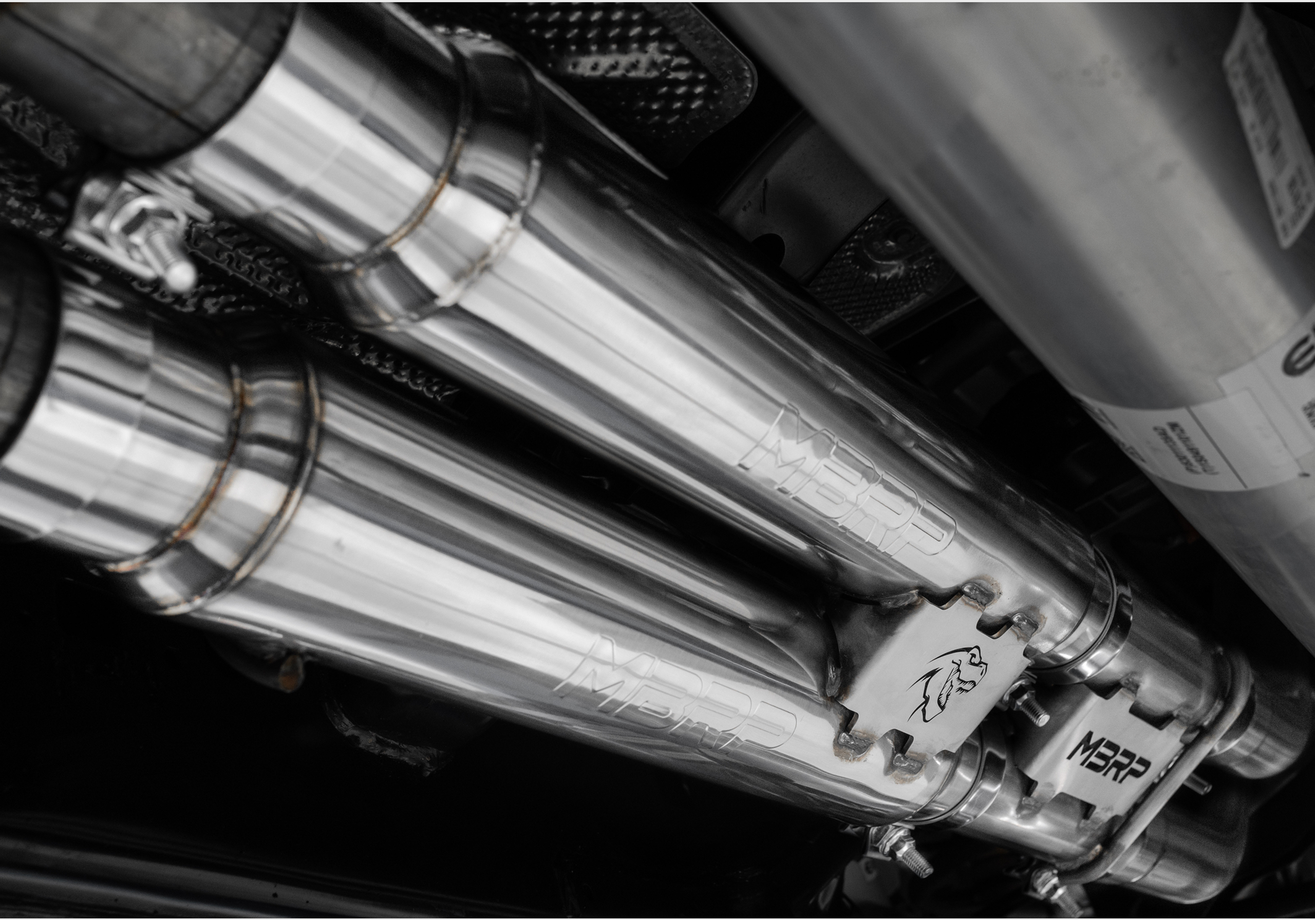 MBRP exhaust install on a Ford Raptor showing the under carriage with expert welding