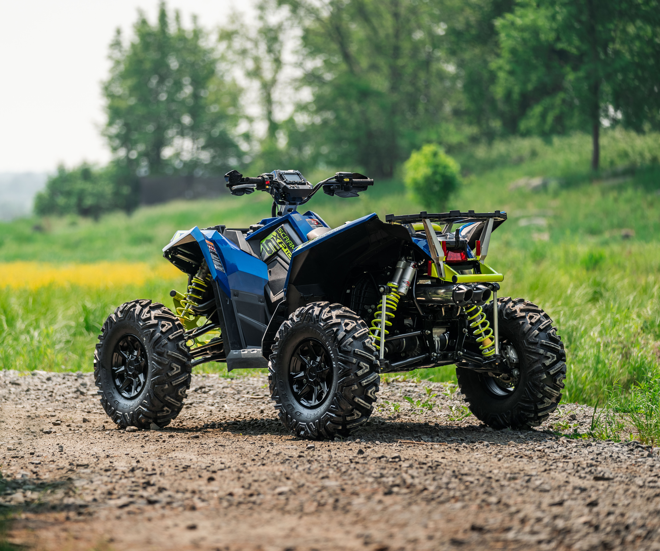 ATV in the field with new mbrp exhaust