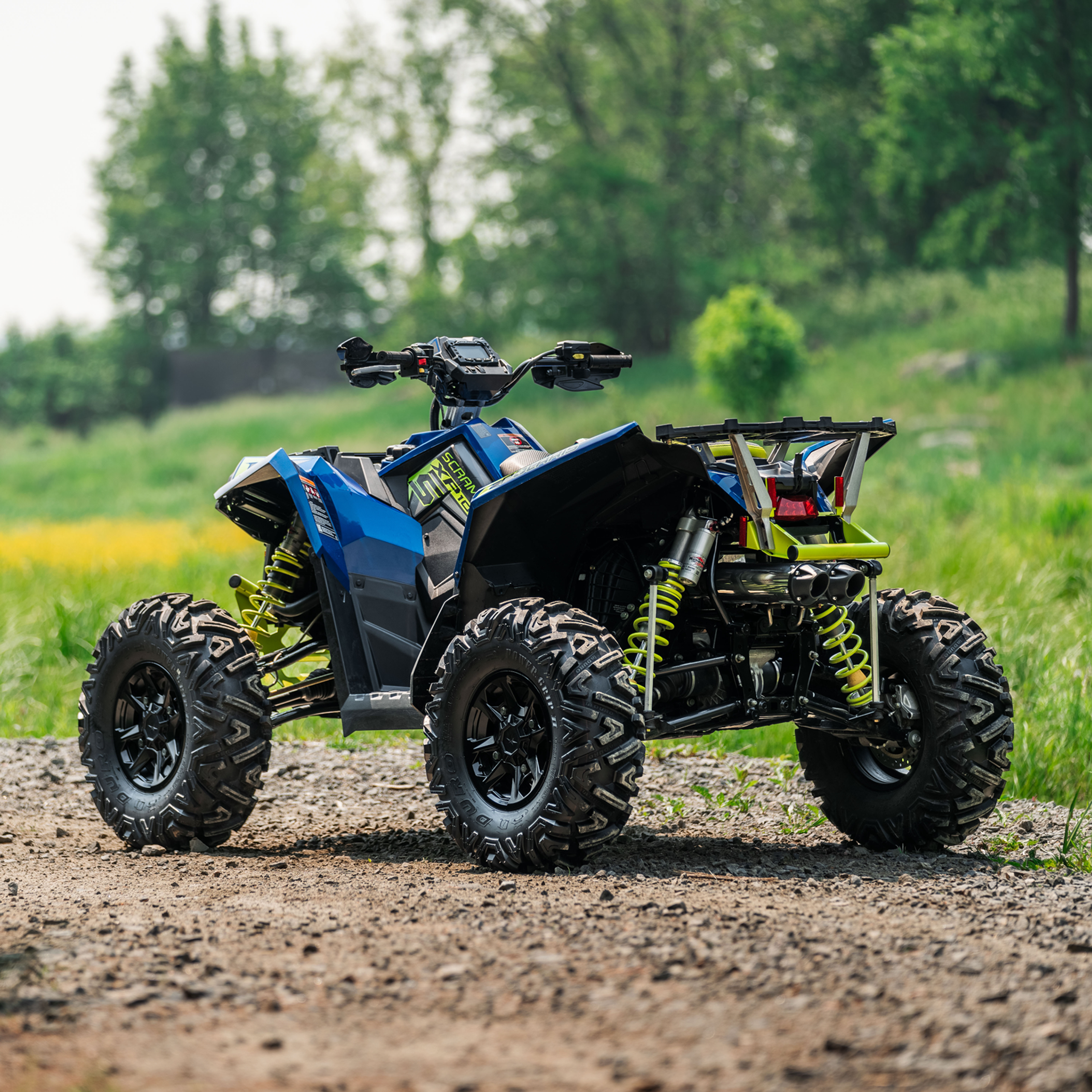 ATV in the field with new mbrp exhaust