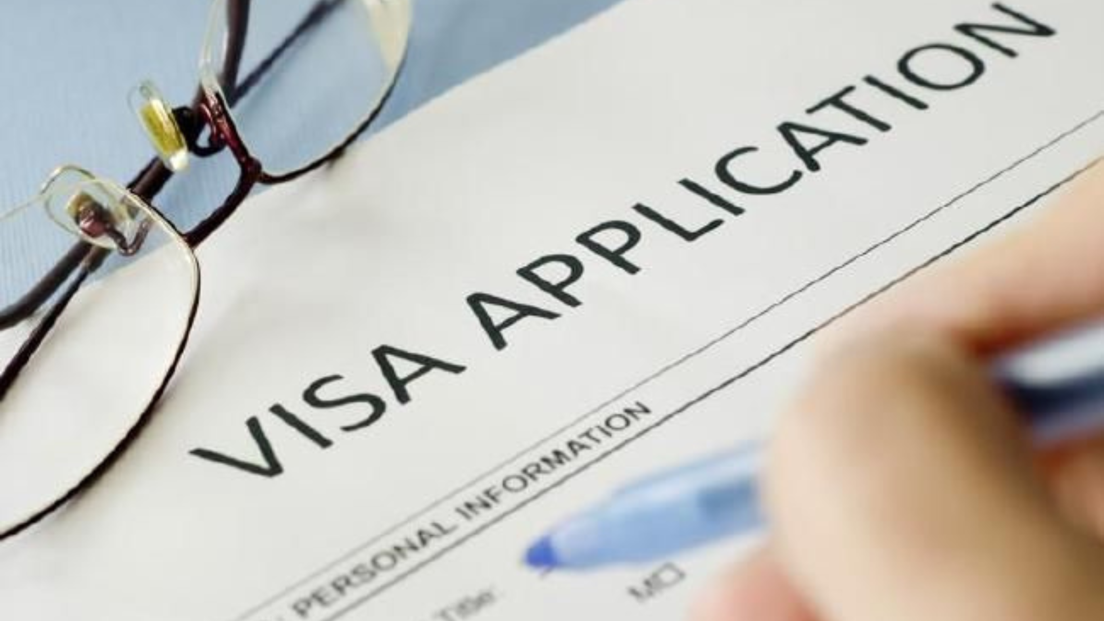 Consultant in Abu Dhabi reviewing Visit Visa documents with a client