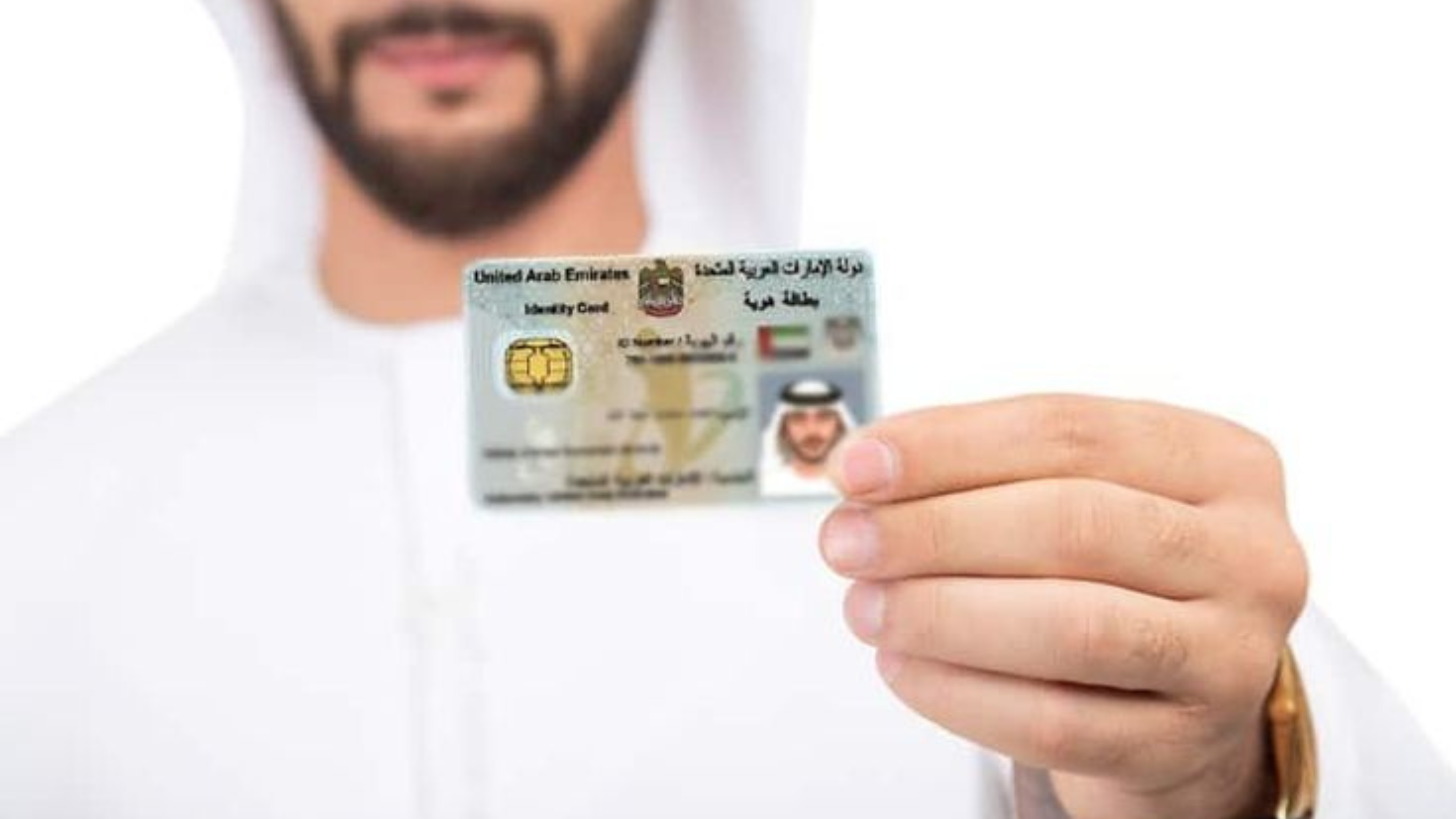 Consultant in Abu Dhabi assisting a client with Emirates ID Typing on a computer