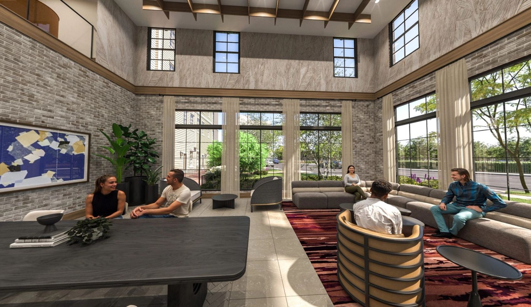 A bright and airy lobby featuring plush seating, spacious tables for work or socializing, high ceilings, and sunlit large windows that create a welcoming atmosphere.