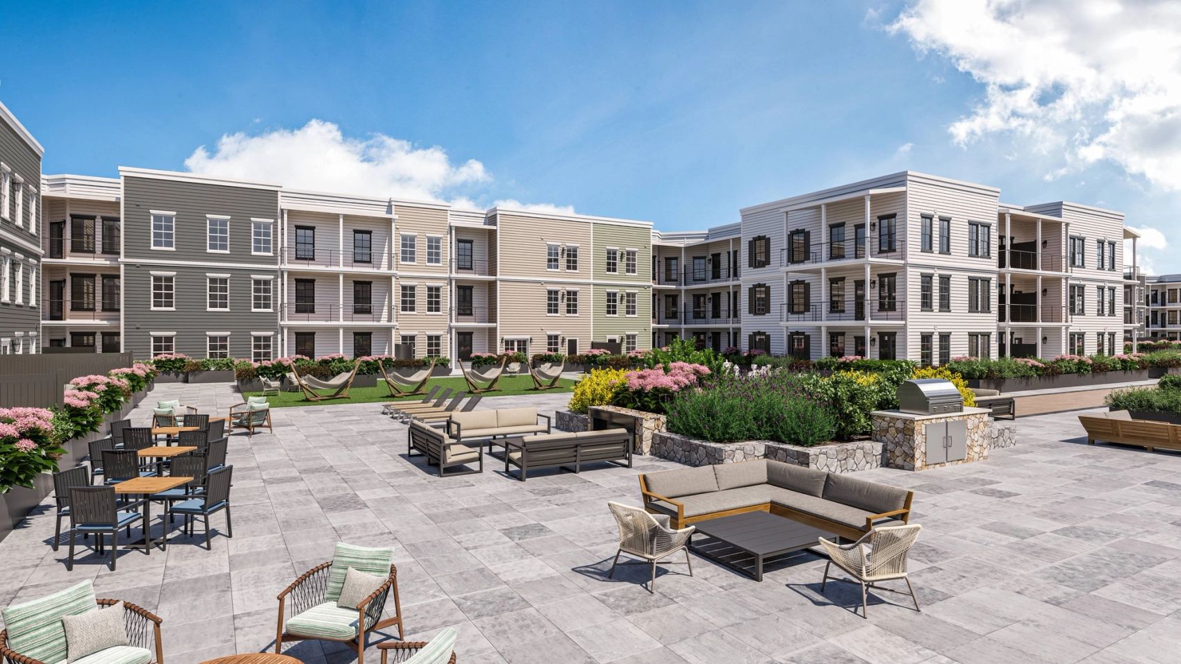 A spacious, welcoming area with ample seating, grills, a firepit, and serving counters—built for dining, entertaining, and connecting with friends and neighbors.