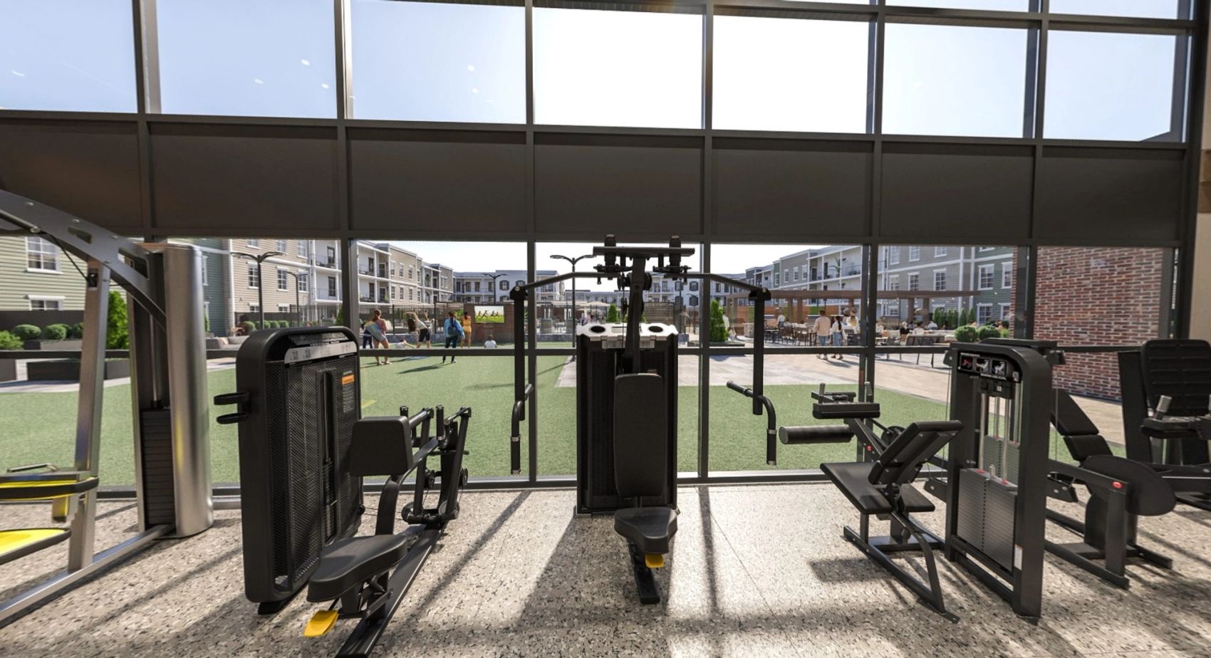 A bright, energizing gym with floor-to-ceiling windows and courtyard views—bringing the outdoors in while you work out.