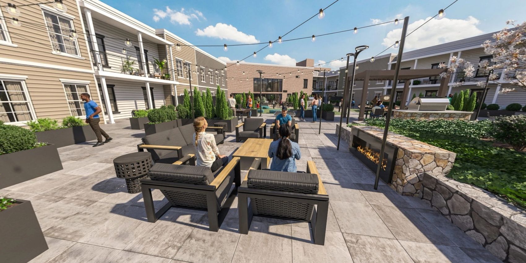 Modern outdoor courtyard with seating, fire pit, string lights, and people socializing.