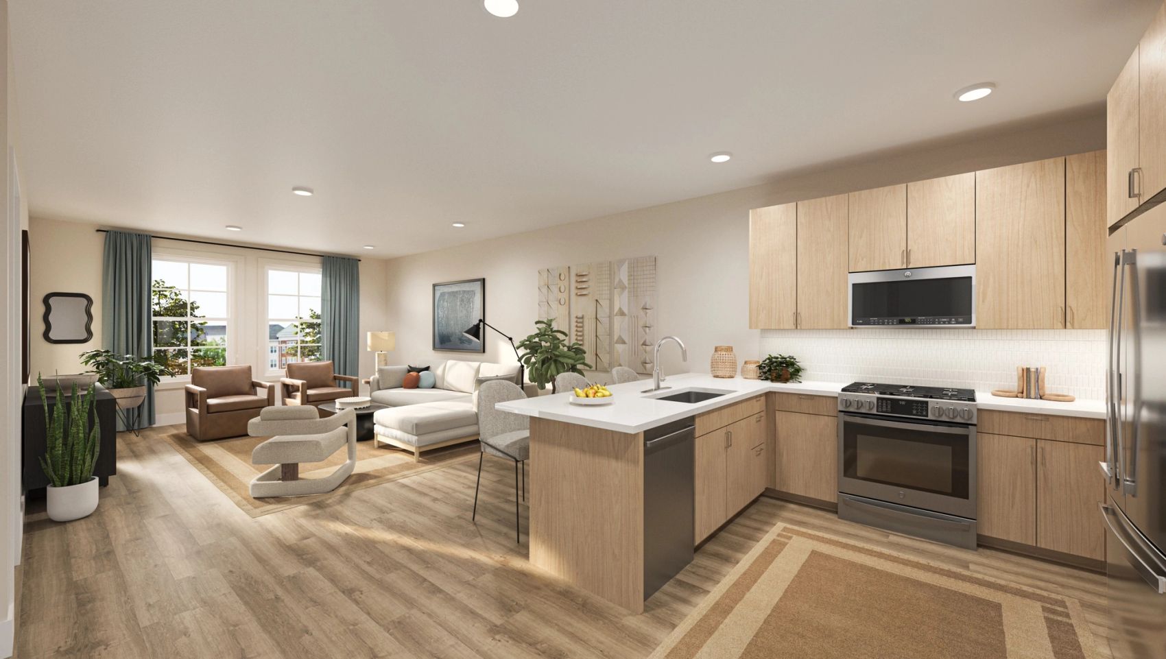 Modern apartment with open kitchen, island seating, stainless appliances, and bright living area.
