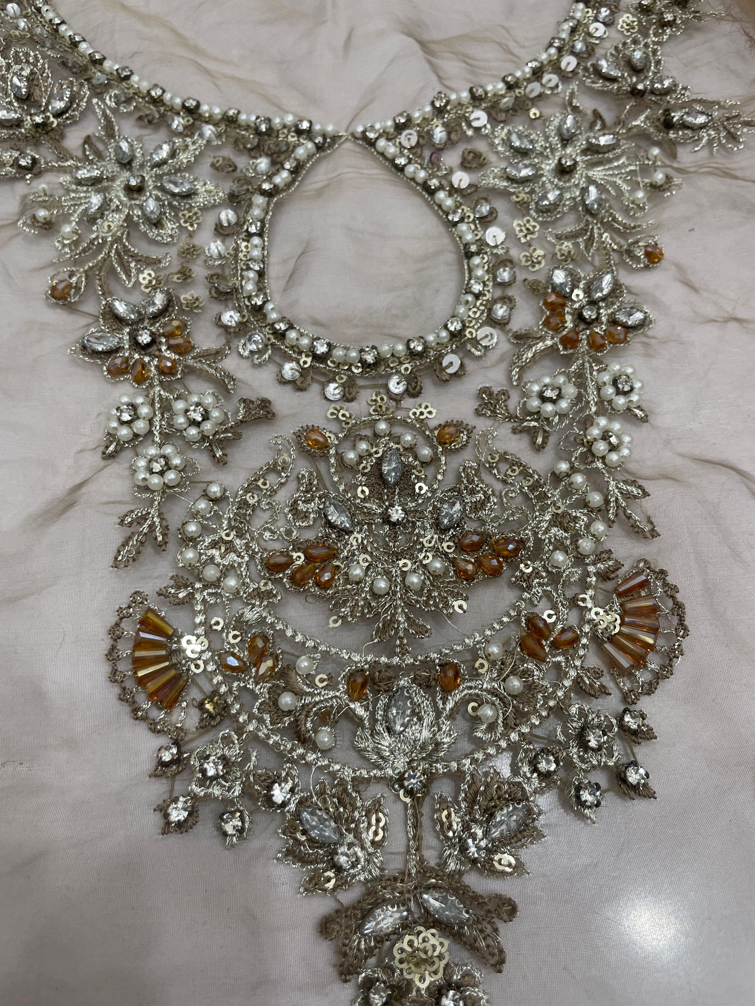 Hand emblished neckline branded