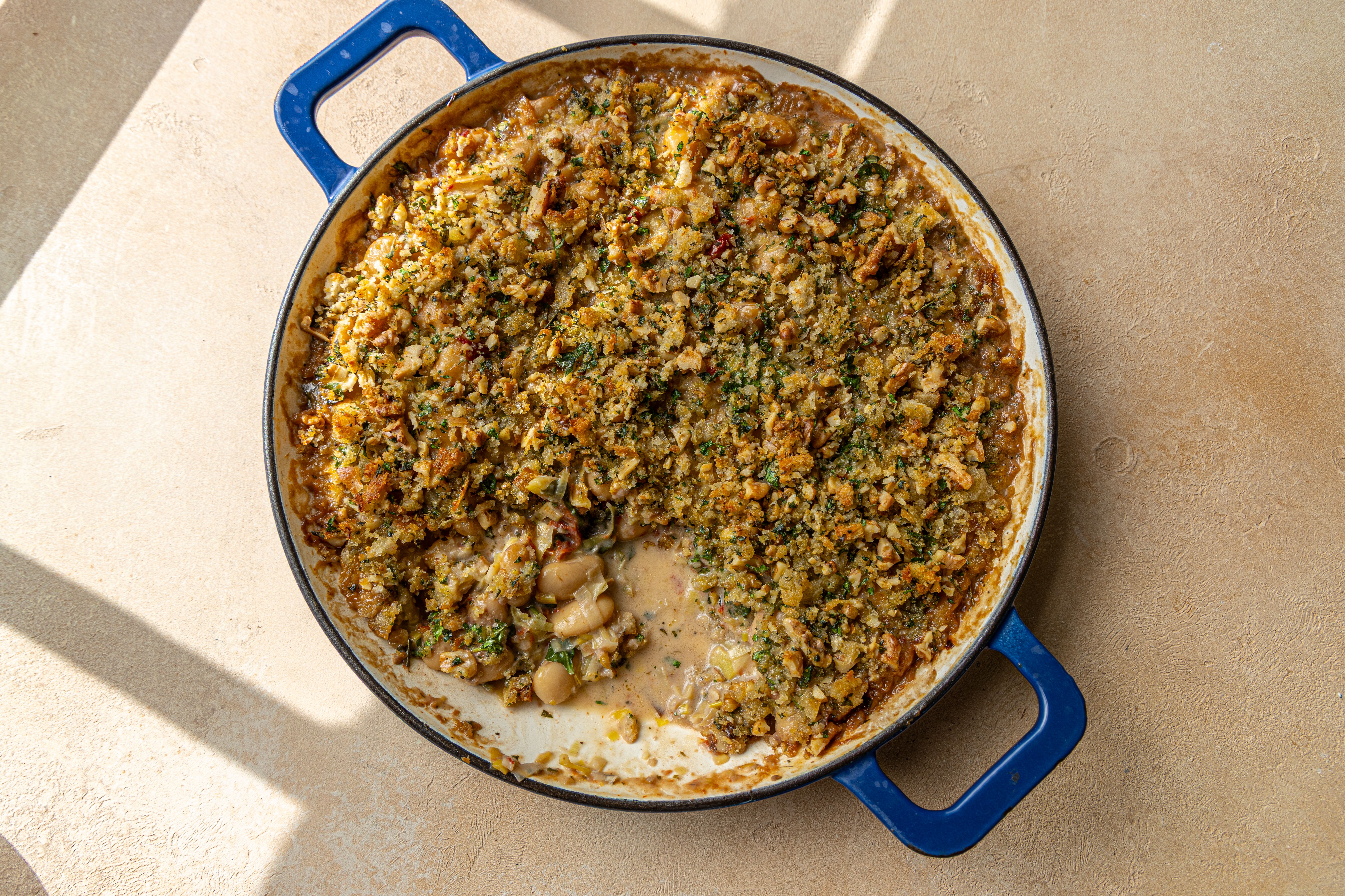 Creamy Tuscan-Style Butter Bean and Leek Gratin with Sun-Dried Tomato and Walnut Crumb