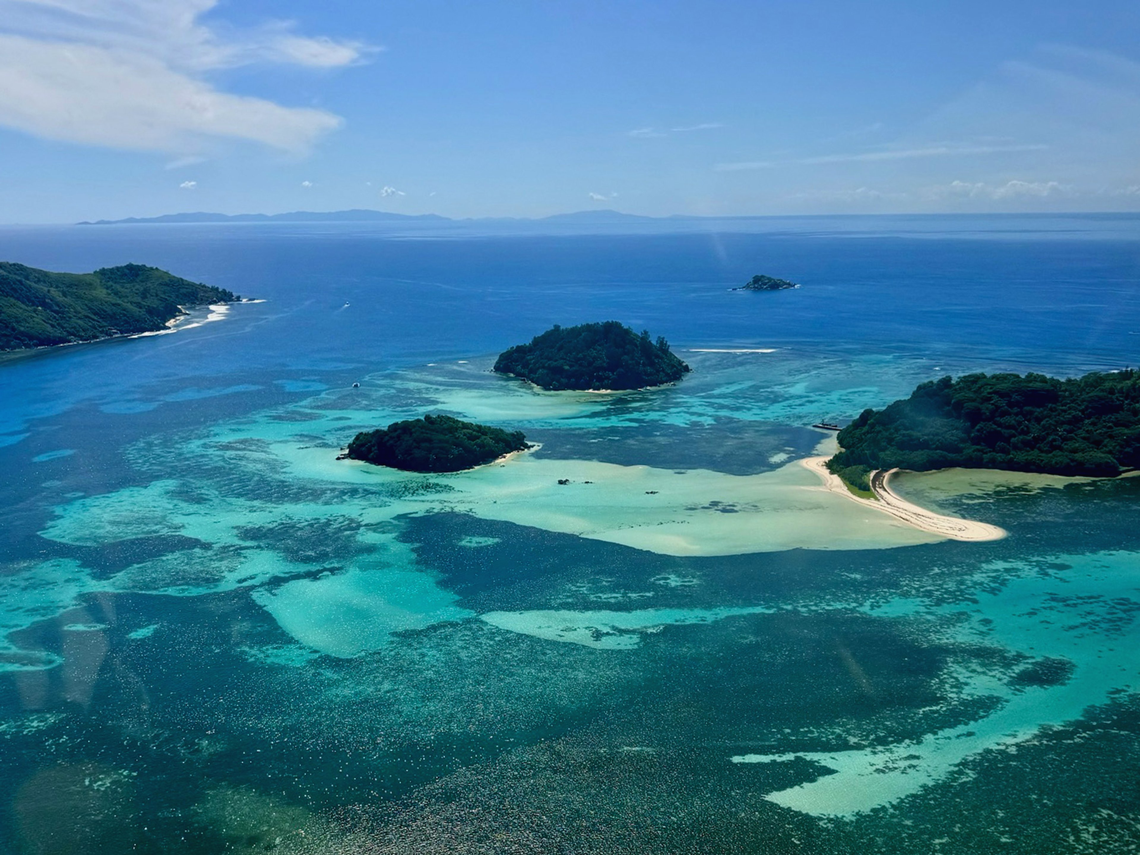 Aerial view of small tropical islands in a turquoise ocean