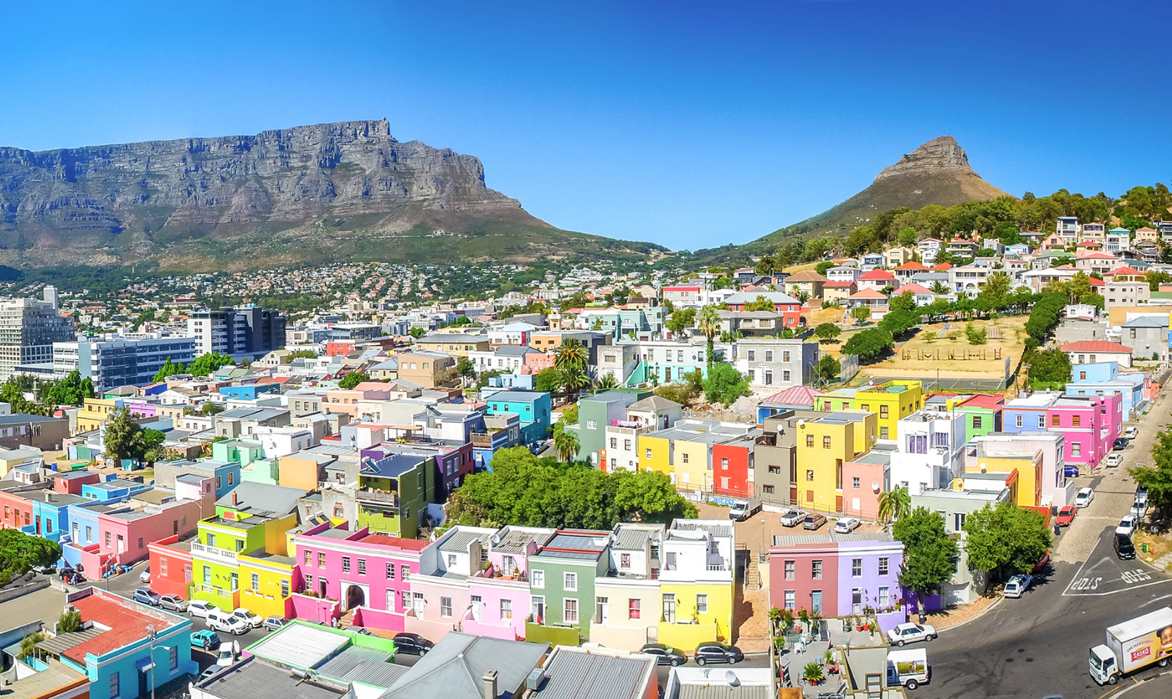 Aerial view of the colorful houses in Bo-Kaap, Cape Town, with Table Mountain and Lion's Head in the background