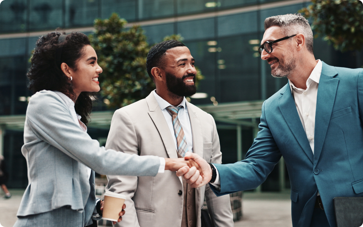 How to start a real estate brokerage agent shaking hands with his clients