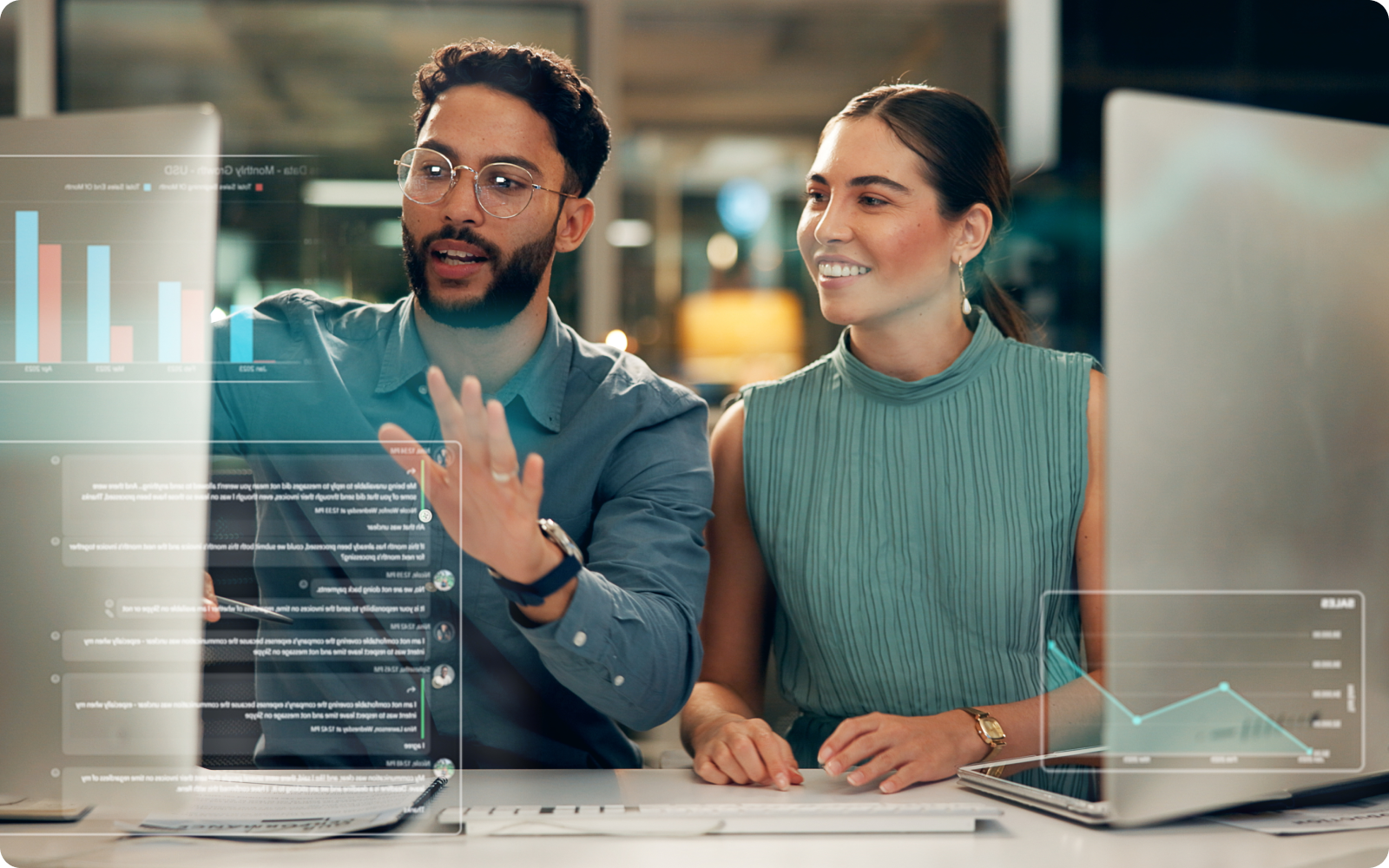 Two agents looking at computer screens with real estate recruiting software
