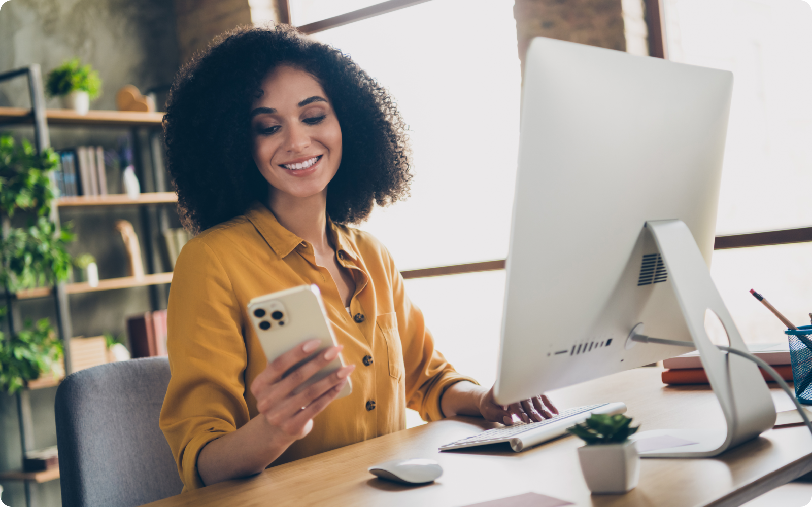 woman holding her mobile phone admiring her real estate listing ad