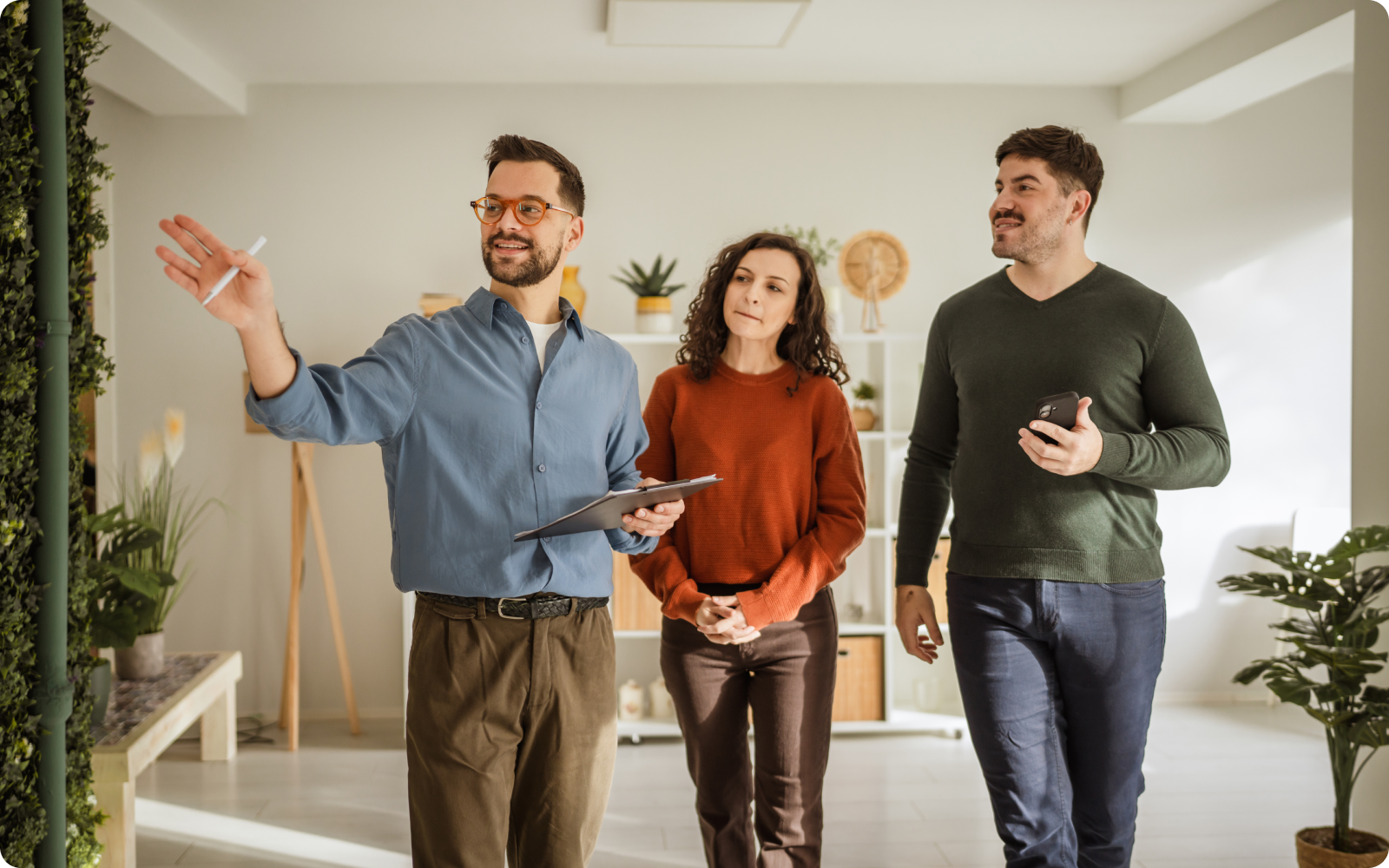 agent showing clients a home they found from a real estate Facebook ad