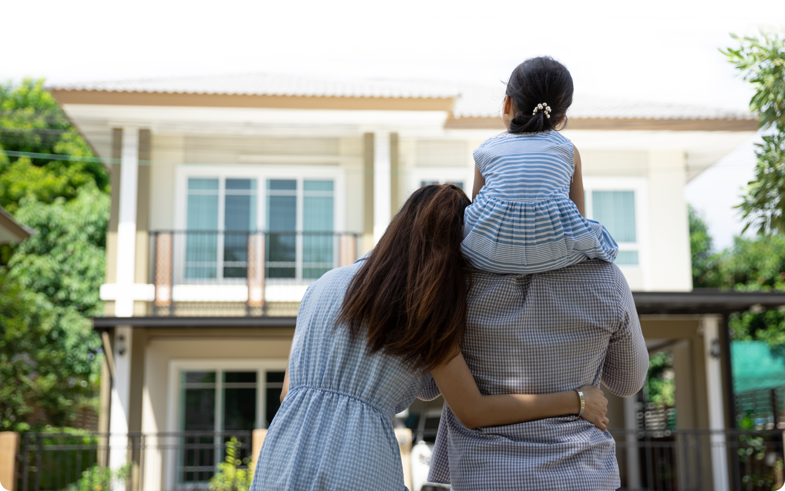 Family admiring their new home for buyer agent transaction checklist blog