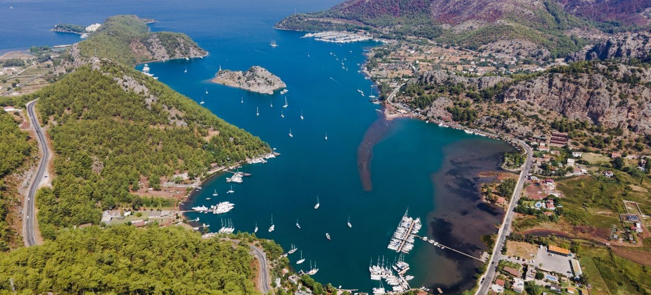 Orhaniye bay, fortified islet and Orhaniye village on Bozburun peninsula in Turkey.