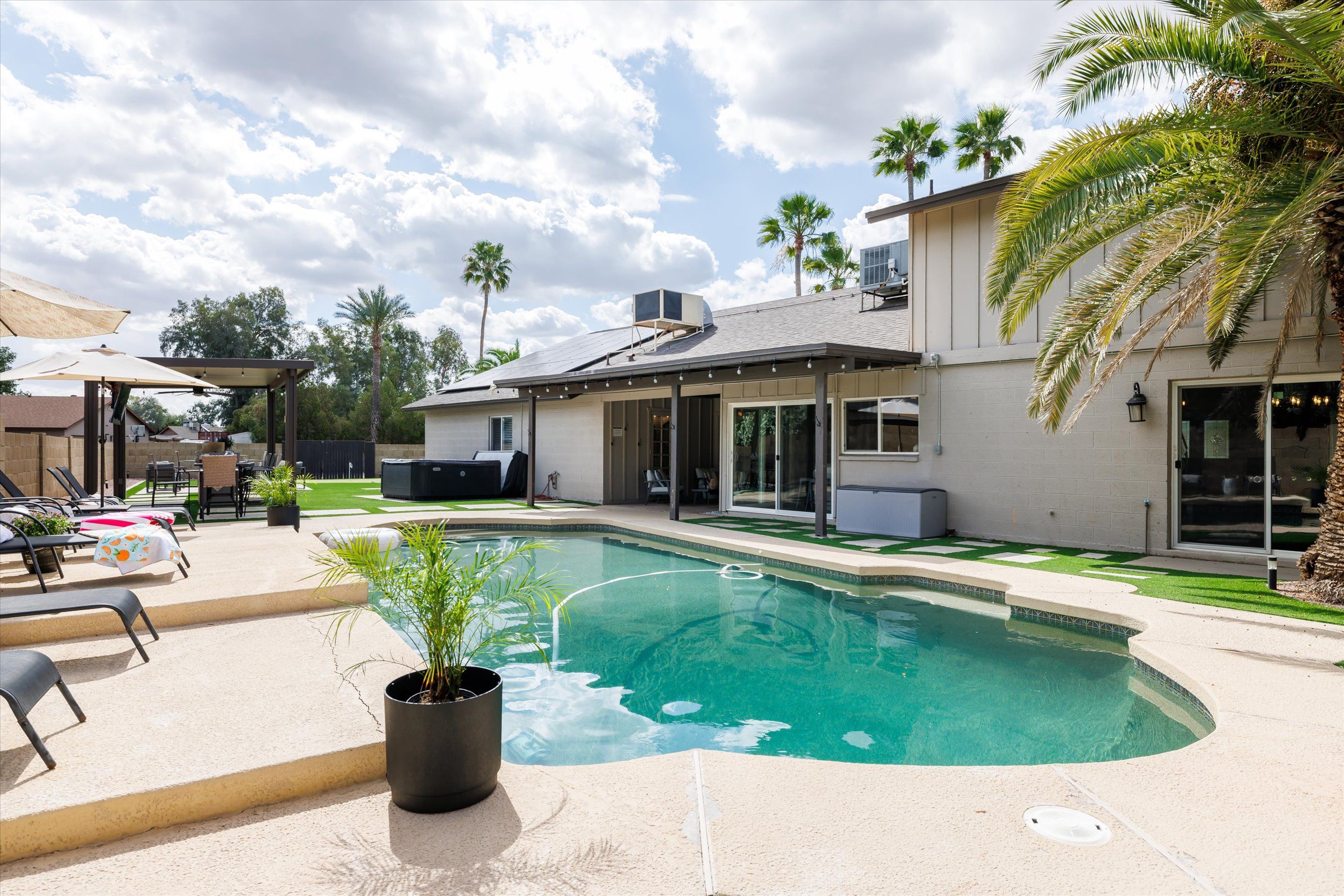 Covered pergola and putting green backyard