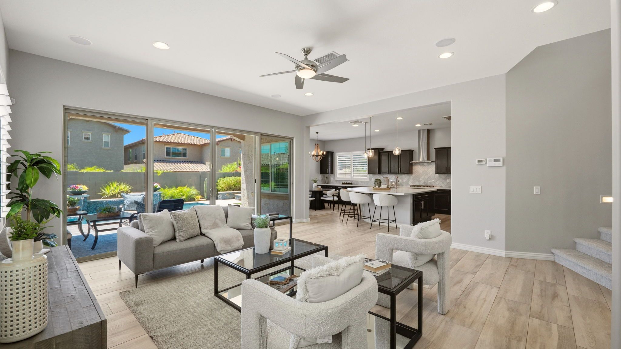 Vista Bonita formal living and dining areas with soaring ceilings and plantation shutters