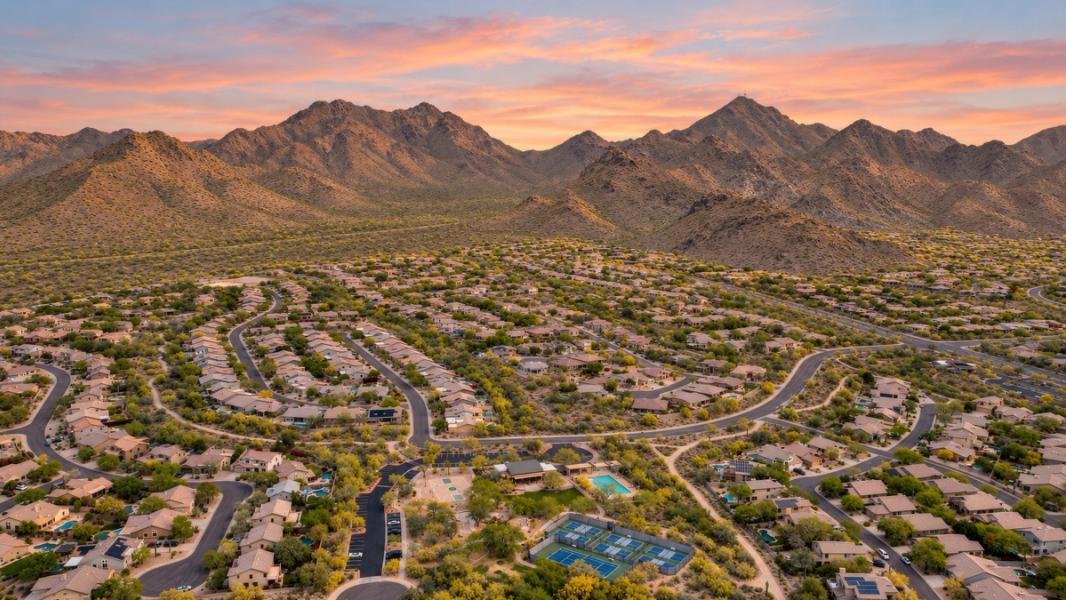 Scottsdale homes beneath the McDowell Mountains at sunset